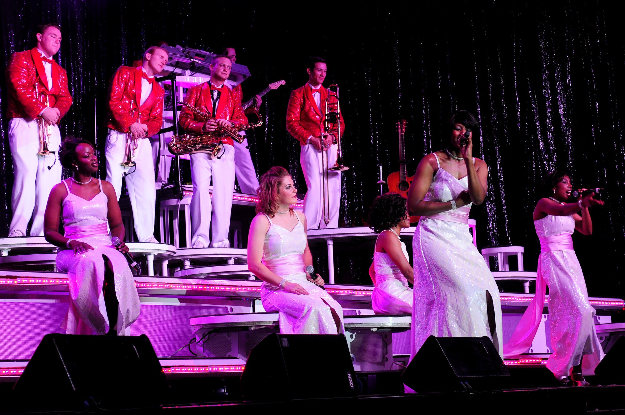 Tops in Blue vocalists sing Oct. 1, 2010 at Incirlik Air Base, Turkey during the Tops in Blue 2010 world tour entitled “We Believe.”  The team’s 2010 schedule will provide musical entertainment for servicemembers and their families throughout the U.S and 25 other countries with close to 140 performances.   (U.S. Air Force photo by Senior Airman Ashley Wood/Released)