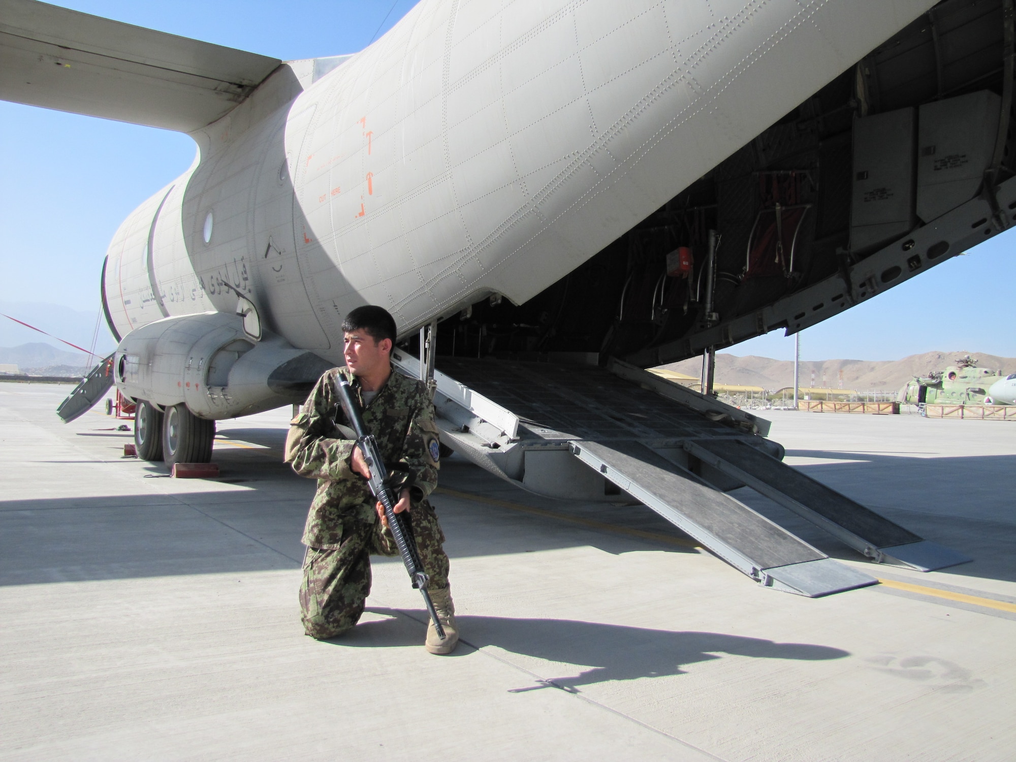 Members of the Afghan Air Force Security Force practice fly away security drill on the C-27 Spartan on Sept 26, 2010.  (U.S. Navy photo by MC1 (AW) Elizabeth Burke/RELEASED).