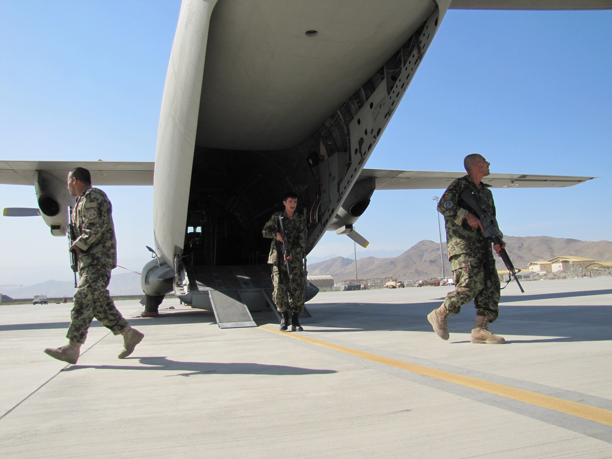 Members of the Afghan Air Force Security Force practice fly away security drill on the C-27 Spartan on Sept 26, 2010.  (U.S. Navy photo by MC1 (AW) Elizabeth Burke/RELEASED).