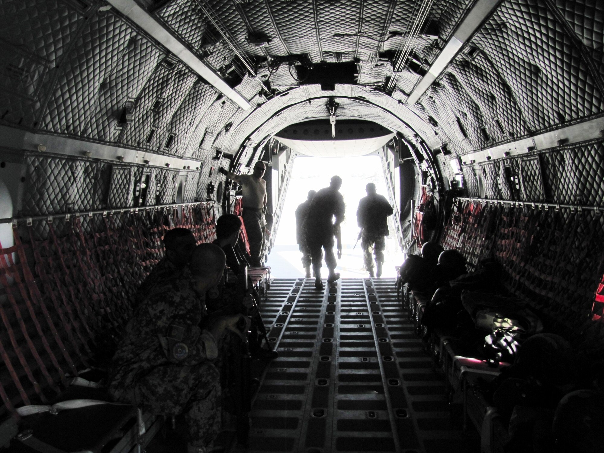 Members of the Afghan Air Force Security Force practice fly away security drill on the C-27 Spartan on Sept 26, 2010.  (U.S. Navy photo by MC1 (AW) Elizabeth Burke/RELEASED).