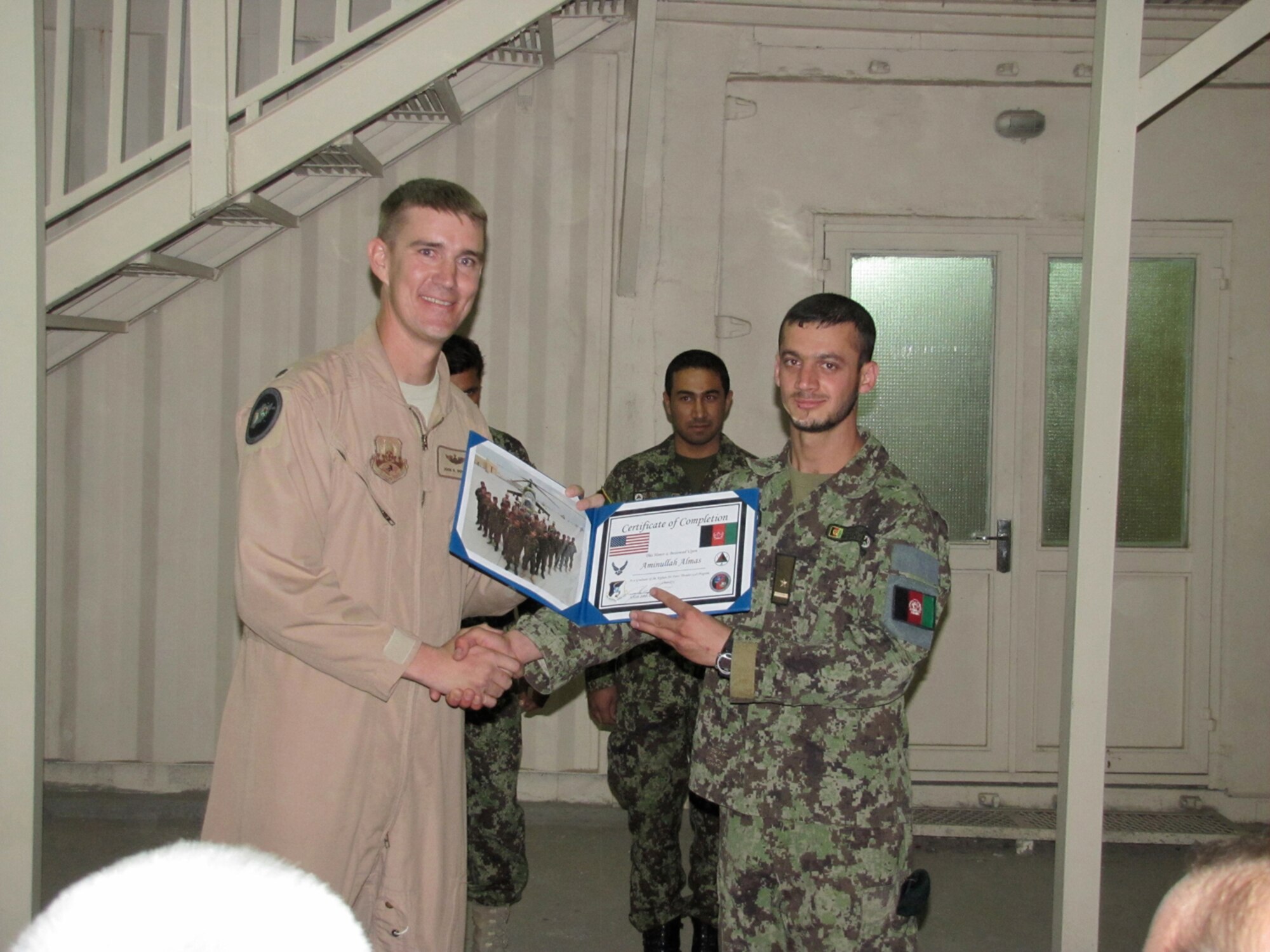 Afghan Air Force Thunder Lab Lieutenants Sign their service commitments prior to leaving for pilot training in the Unites States on the air force base in Kabul on October 3, 2010. (Mass Communications Specialist First Class Elizabeth Burke/RELEASED).