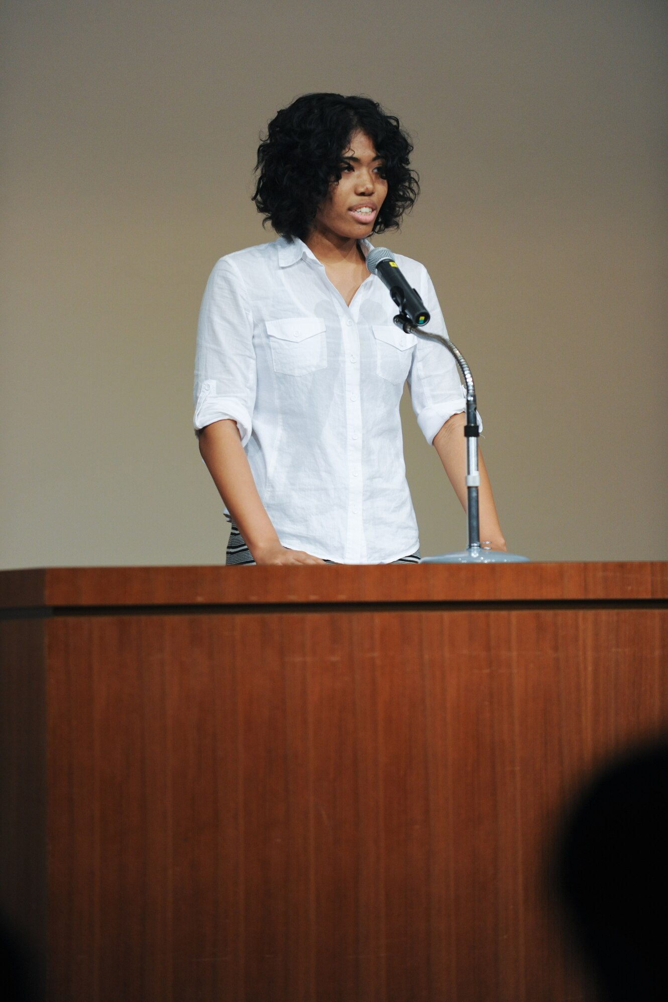 FUSSA CITY, Japan -- Mei McDaniel, Yokota high school, receives 1st place of high school category in the Japanese speech contest. The Japan-United States Speech Contest, hosted by the North Kanto Defense Bureau, featured Japanese junior high school students giving speeches in English and Yokota Middle and High School students giving speeches in Japanese at Fussa Citizens Hall, Oct. 3. (U.S. Air Force photo/Osakabe Yasuo)
