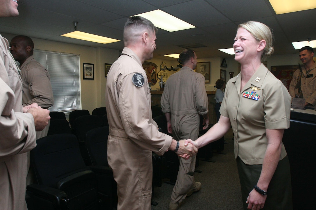 Capt. Alexis Paschedag, a UH-1Y "Huey" helicopter pilot, is congratulated by her fellow Marines after receiving the Order of Daedalians 2009 Exceptional Pilot Award at Marine Corps Base Camp Pendleton Oct. 4. Only one award is given to each branch of service every year.