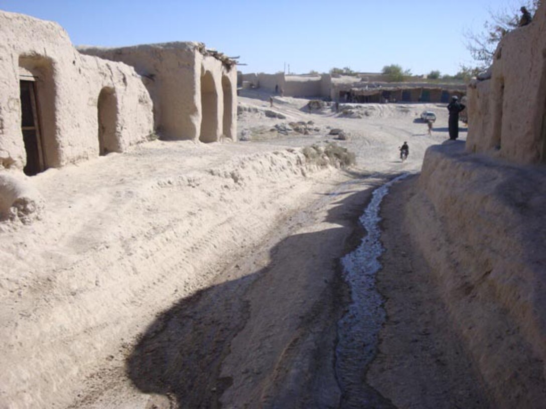 The road through the village of Shir Ghazay (above) was in such terrible shape, the Marines of 9th Engineer Support Battalion, 1st Marine Logistics Group (Forward) made it their mission to repair the road leading from the village to the town of Gurjat. All told, the Marines repaired four kilometers worth of road, and also improved or replaced several culverts, aiding local farmers in irrigating their fields. The road improvements will improve trafficability for both coalition forces as well as Shir Ghazay residents.