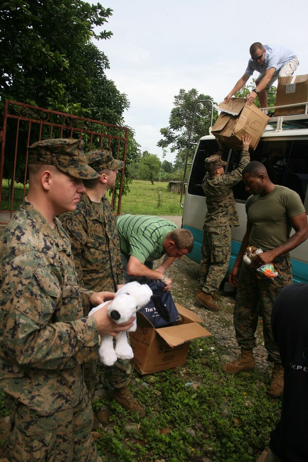 Sgt.William Aynes , a civil affairs specialist with II Marine Expeditionary Force 10th Marines Civil Affairs Detachment and  fellow Marines with non-government organization Give a Kid a Backpack, prepare to pass out stuffed animals to children at a school in Grand Chiriqui, Panama, Oct. 5. Three civil affairs Marines from  II Marine Expeditionary Force 10th Marines Civil Affairs Detachment have deployed with Special-Purpose Marine Air-Ground Task Force Continuing Promise 2010, which is a humanitarian civic assistance mission that provides medical, dental, veterinary, engineering support and disaster relief efforts to the Caribbean, Central and South America. Aynes hails from Johnstown, Colo.