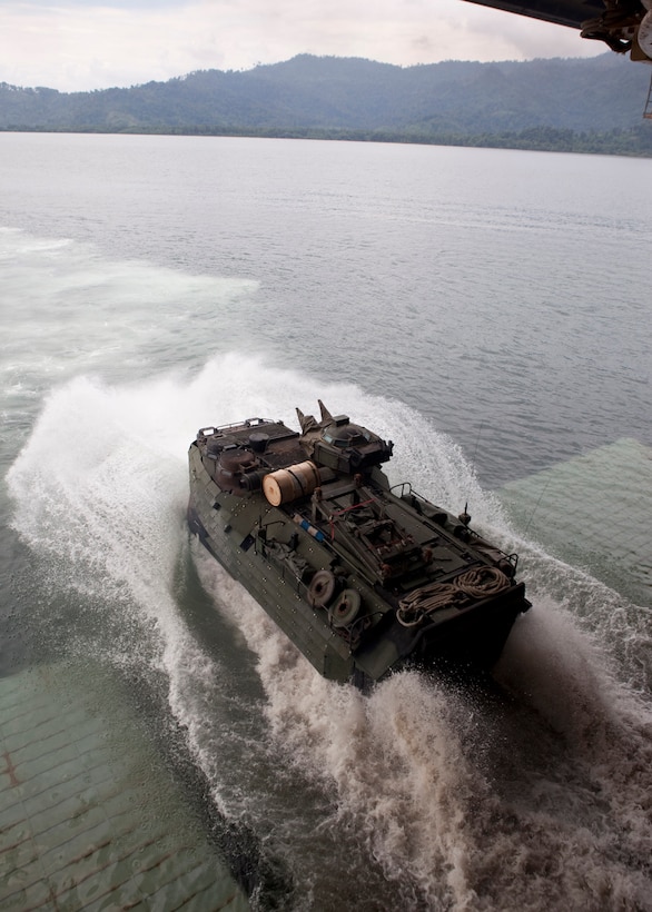 An amphibious assault vehicle, with Company A, 2nd Assault Amphibian Battalion, attached to Special-Purpose Marine Air-Ground Task Force Continuing Promise 2010, launches from the well deck of the amphibious assault ship USS Iwo Jima (LHD7), during demonstrations for service members and civilians, off the coast of Chiriqui Grande, Panama, Oct. 5. Service members and civilians are deployed in support of CP10 providing medical, dental, veterinary, engineering assistance and subject-matter exchanges to Caribbean, Central and South American nations.