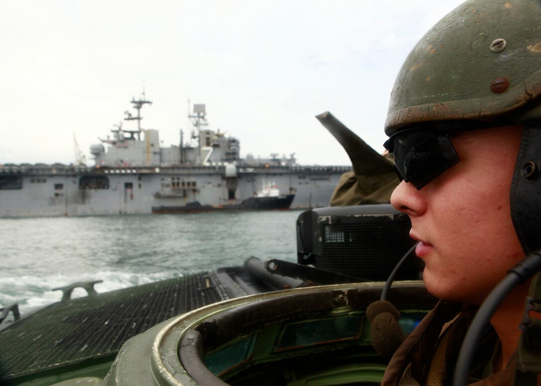 U.S. Marine Lance Cpl. Brock A. Goldbeck, a crewman with Company A, 2nd Assault Amphibian Battalion, attached to Special-Purpose Marine Air-Ground Task Force Continuing Promise 2010, operates an amphibious assault vehicle, off the coast of Chiriqui Grande, Panama, during demonstrations, Oct. 5. Service members and civilians are deployed in support of CP10 providing medical, dental, veterinary, engineering assistance and subject-matter exchanges to Caribbean, Central and South American nations.