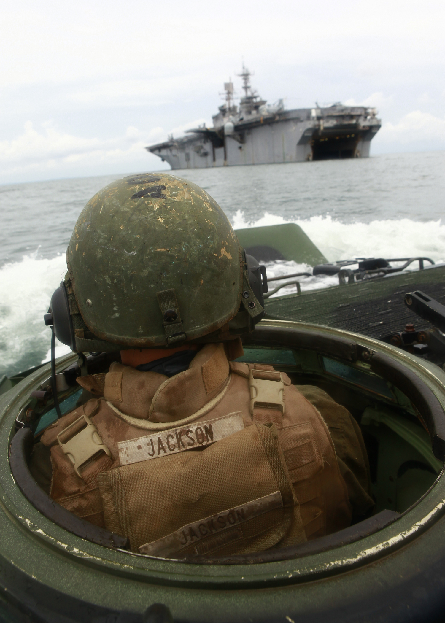 U.S. Marine Lance Cpl. Brock A. Goldbeck, a crewman with Company A, 2nd Assault Amphibian Battalion, attached to Special-Purpose Marine Air-Ground Task Force Continuing Promise 2010 (CP10), operates an amphibious assault vehicle (AAV), off the coast of Chiriqui Grande, Panama, during demonstrations for service members and civilians, Oct. 5, 2010. Service members and civilians are deployed in support of CP10 providing medical, dental, veterinary, engineering assistance and subject-matter exchanges to Caribbean, Central and South American nations. (U.S. Marine Corps photo by Sgt. Samuel R. Beyers/Released)