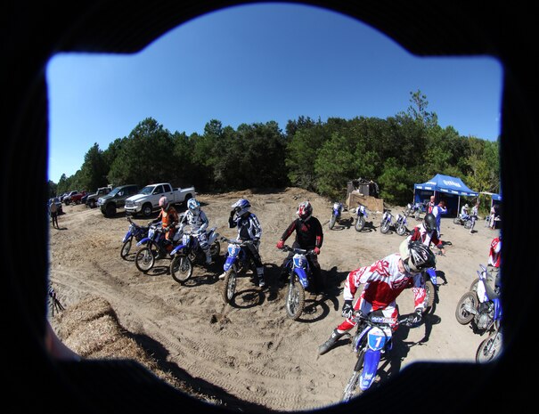 Riders from II Marine Expeditionary Force and instructors from American Supercamp, a motorcycle school based out Ft. Collins, Colo., ride dirt bikes during a safety class, Oct. 6, 2010, at Marine Corps Auxiliary Landing Field Bogue, N.C. During the training, veteran motorcyclists who have competed in national competitions taught the Marines and sailors in attendance the basics of riding dirt bikes on dirt and pavement.(U.S. Marine Corps Photo by Cpl. Bobbie A. Curtis)