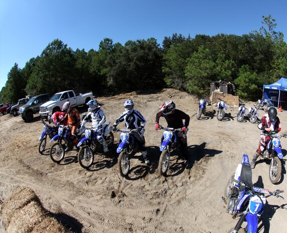 Riders from II Marine Expeditionary Force and instructors from American Supercamp, a motorcycle school based out Ft. Collins, Colo., ride dirt bikes during a safety class, Oct. 6, 2010, at Marine Corps Auxiliary Landing Field Bogue, N.C. During the training, veteran motorcyclists who have competed in national competitions taught the Marines and sailors in attendance the basics of riding dirt bikes on dirt and pavement.(U.S. Marine Corps Photo by Cpl. Bobbie A. Curtis)