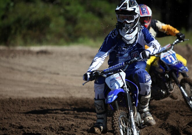 Riders from II Marine Expeditionary Force and instructors from American Supercamp, a motorcycle school based out Ft. Collins, Colo., ride dirt bikes during a safety class, Oct. 6, 2010, at Marine Corps Auxiliary Landing Field Bogue, N.C. During the training, veteran motorcyclists who have competed in national competitions taught the Marines and sailors in attendance the basics of riding dirt bikes on dirt and pavement.(U.S. Marine Corps Photo by Cpl. Bobbie A. Curtis)