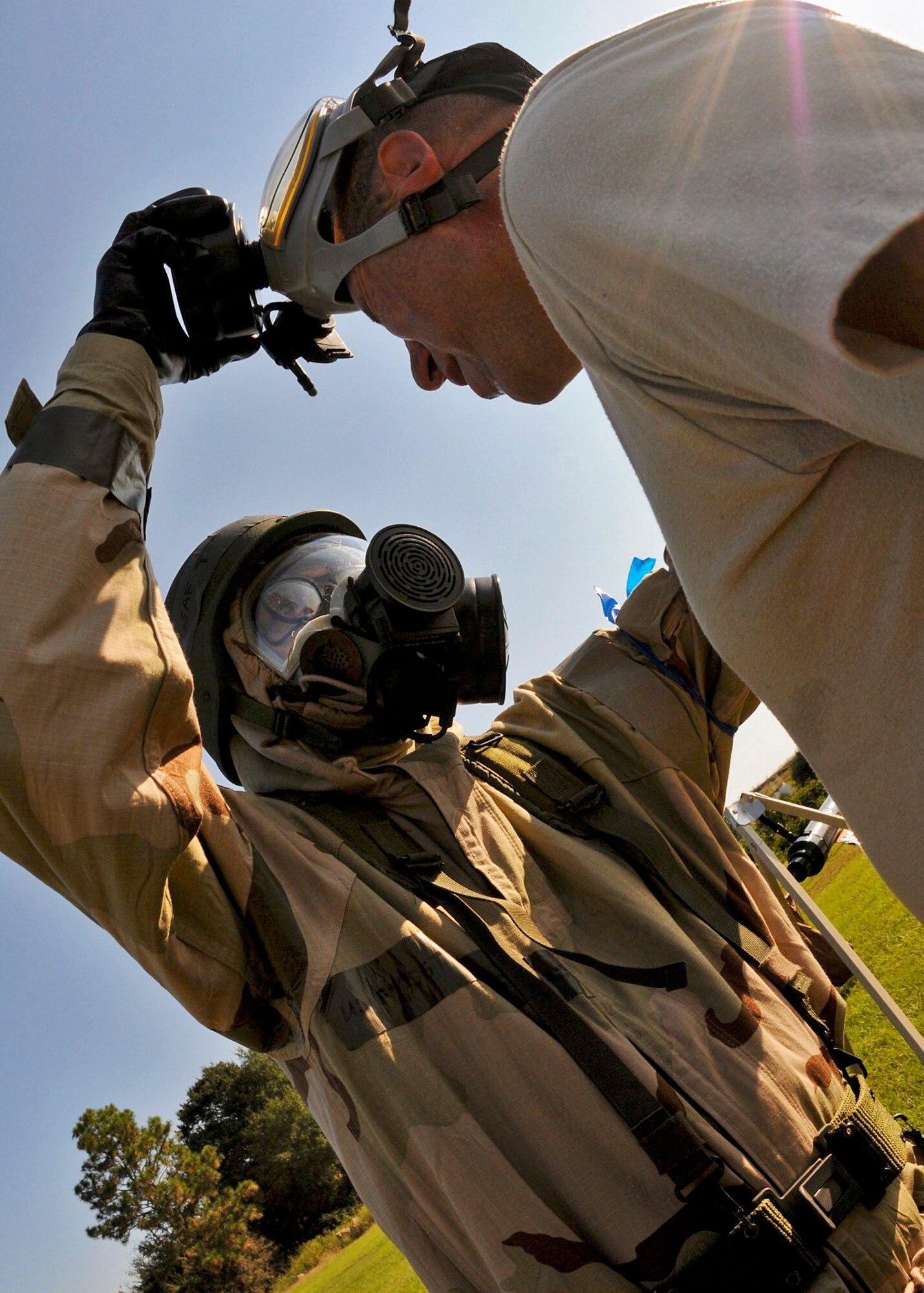 Tech. Sgt. Manuel Sanchez Jr., 919th Maintenance Squadron, removes the gas mask of a contamination victim at the last station of the decontamination area during Day two of the 919th Special Operations Wing’s Ability to Survive and Operate exercise, Oct. 3 at Duke Field, Fla.  The Reserve unit exercised preparing deployers, Mission Oriented Protective Posture and command and control procedures during the Unit Training Assembly weekend.  (U.S. Air Force photo/Tech. Sgt. Samuel King Jr.)