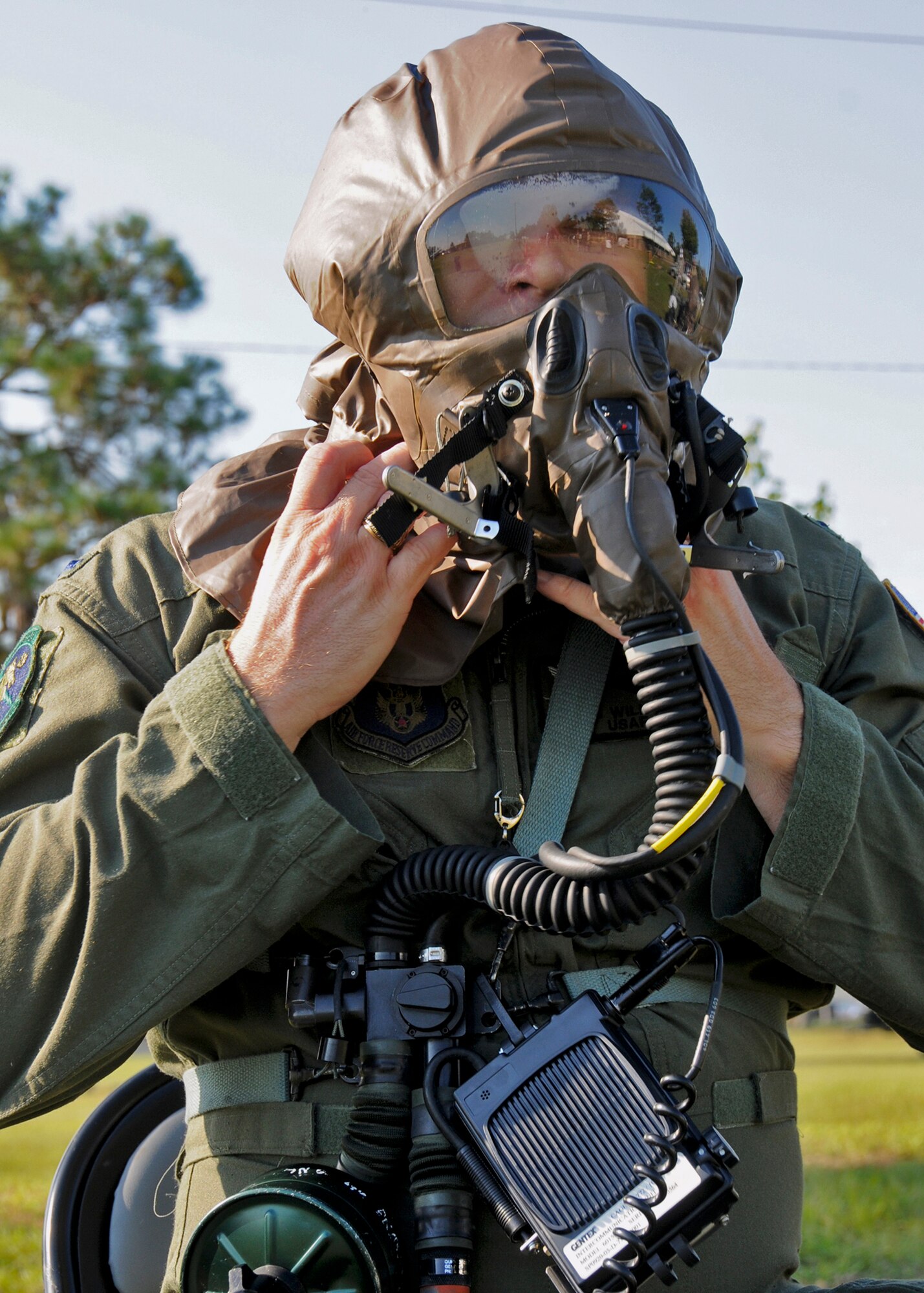 A lieutenant with the 711th Special Operations Squadron, begins to remove his gas mask during Day two of the wing’s Ability to Survive and Operate exercise, Oct. 3 at Duke Field, Fla.  The Reserve unit exercised preparing deployers, Mission Oriented Protective Posture and command and control procedures during the Unit Training Assembly weekend.  (U.S. Air Force photo/Tech. Sgt. Samuel King Jr.)