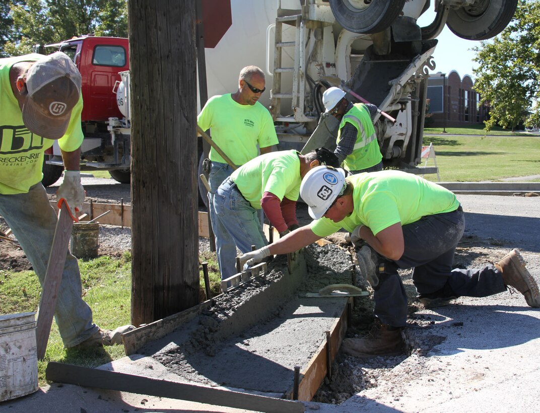Work crews began tearing out the old ashphalt parking lot behind the 932nd Airlift Wing headquarters building.  The project will include a new parking lot, sidewalks and curbing.  (U.S. Air Force photo/Tech. Sgt. Dan Oliver)
