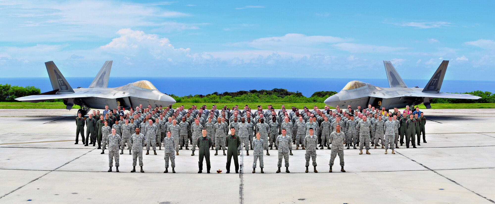 Servicemembers from Langley Air Force Base pose for a group shot while deployed to Anderesen AFB and the 27th Expeditionary Fighter Squadron. The 27th EFS supports the Theater Security Package in the Pacific. (Photo illustration/Tech. Sgt. Mike Andriacco)