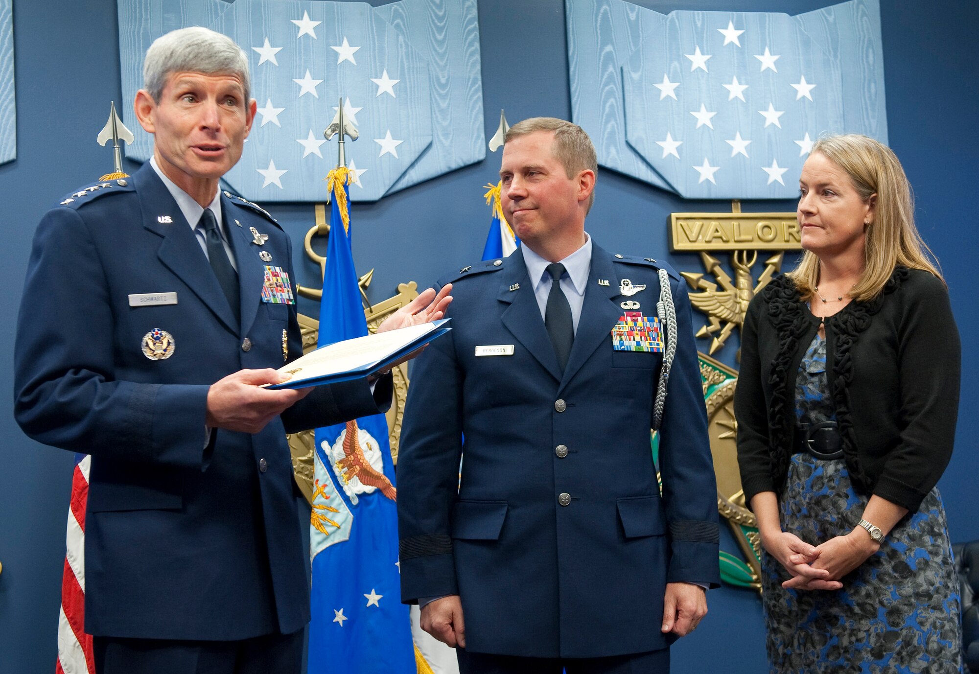 Air Force Chief of Staff Gen. Norton Schwartz (left) presents the 2010 General and Mrs. Jerome F. O'Malley award to Brig. Gen. Thomas W. Bergeson and his wife Pamela during a ceremony in the Pentagon Oct. 4, 2010. The award is presented annually to the wing commander and spouse team who have best exhibited their own courage, power, grace and beauty in caring for Air Force families. The award was established after the O'Malleys, who were known for their leadership and contributions to Air Force families and communities, were tragically killed in a plane crash in 1985. (U.S. Air Force photo/Jim Varhegyi)