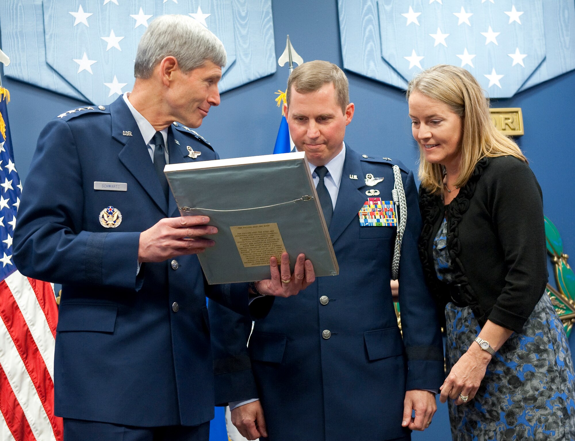 Air Force Chief of Staff Gen. Norton Schwartz (left) presents the 2010 General and Mrs. Jerome F. O'Malley award to Brig. Gen. Thomas W. Bergeson and his wife Pamela during a ceremony in the Pentagon Oct. 4, 2010. The award is presented annually to the wing commander and spouse team who have best exhibited their own courage, power, grace and beauty in caring for Air Force families. The award was established after the O'Malleys, who were known for their leadership and contributions to Air Force families and communities, were tragically killed in a plane crash in 1985. (U.S. Air Force photo/Jim Varhegyi)