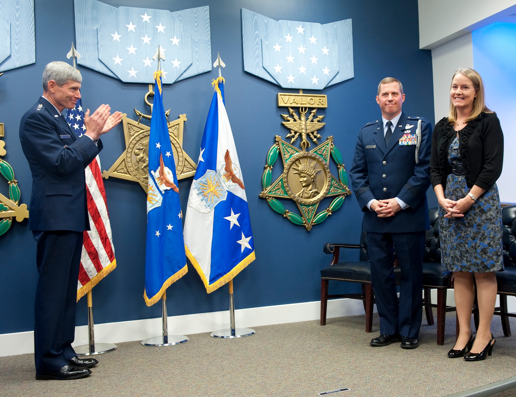 Air Force Chief of Staff Gen. Norton Schwartz (left) applauds after presenting the 2010 General and Mrs. Jerome F. O'Malley award to Brig. Gen. Thomas W. Bergeson and his wife Pamela during a ceremony in the Pentagon Oct. 4, 2010. The award is presented annually to the wing commander and spouse team who have best exhibited their own courage, power, grace and beauty in caring for Air Force families. The award was established after the O'Malleys, who were known for their leadership and contributions to Air Force families and communities, were tragically killed in a plane crash in 1985. (U.S. Air Force photo/Jim Varhegyi)