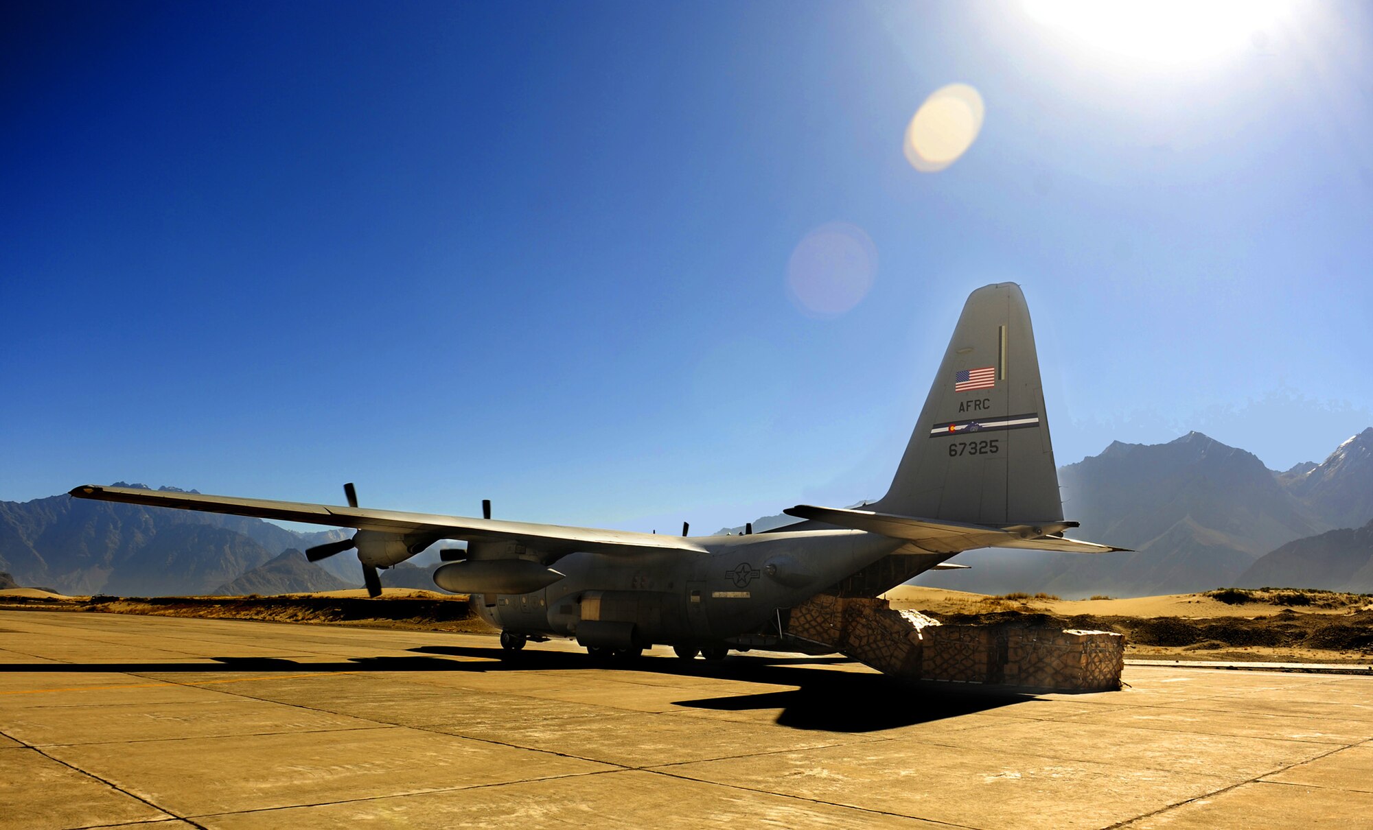 An Air Force Reserve C-130 Hercules combat offloads four pallets of flood relief supplies Oct. 3 at Skardu Airport in northern Pakistan. The mission, flown by 302nd Airlift Wing aircrews from Peterson Air Force Base, Colo., who are deployed to Southwest Asia in support of U.S. Central Command operations, was one of the last fixed-wing operations supporting flood relief in Pakistan. Between Aug. 16 and Oct. 3, C-130 Hercules and C-17 Globemaster III aircraft and their aircrews transported nearly 6 million pounds of much-needed relief supplies to Pakistan aid distribution centers throughout the country. (U.S. Air Force photo/Staff Sgt. Andy Kin)