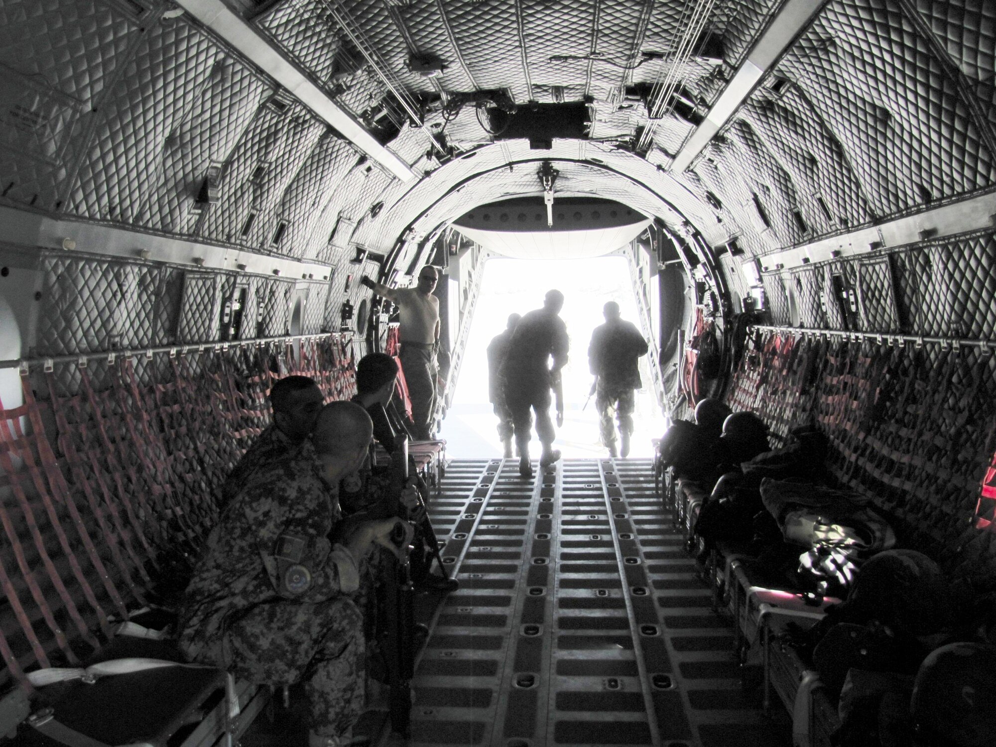 Afghan air force security forces members practice fly away security drill on the C-27 Spartan on Sept 26, 2010. (U.S. Navy photo/Petty Officer 1st Class Elizabeth Burke)