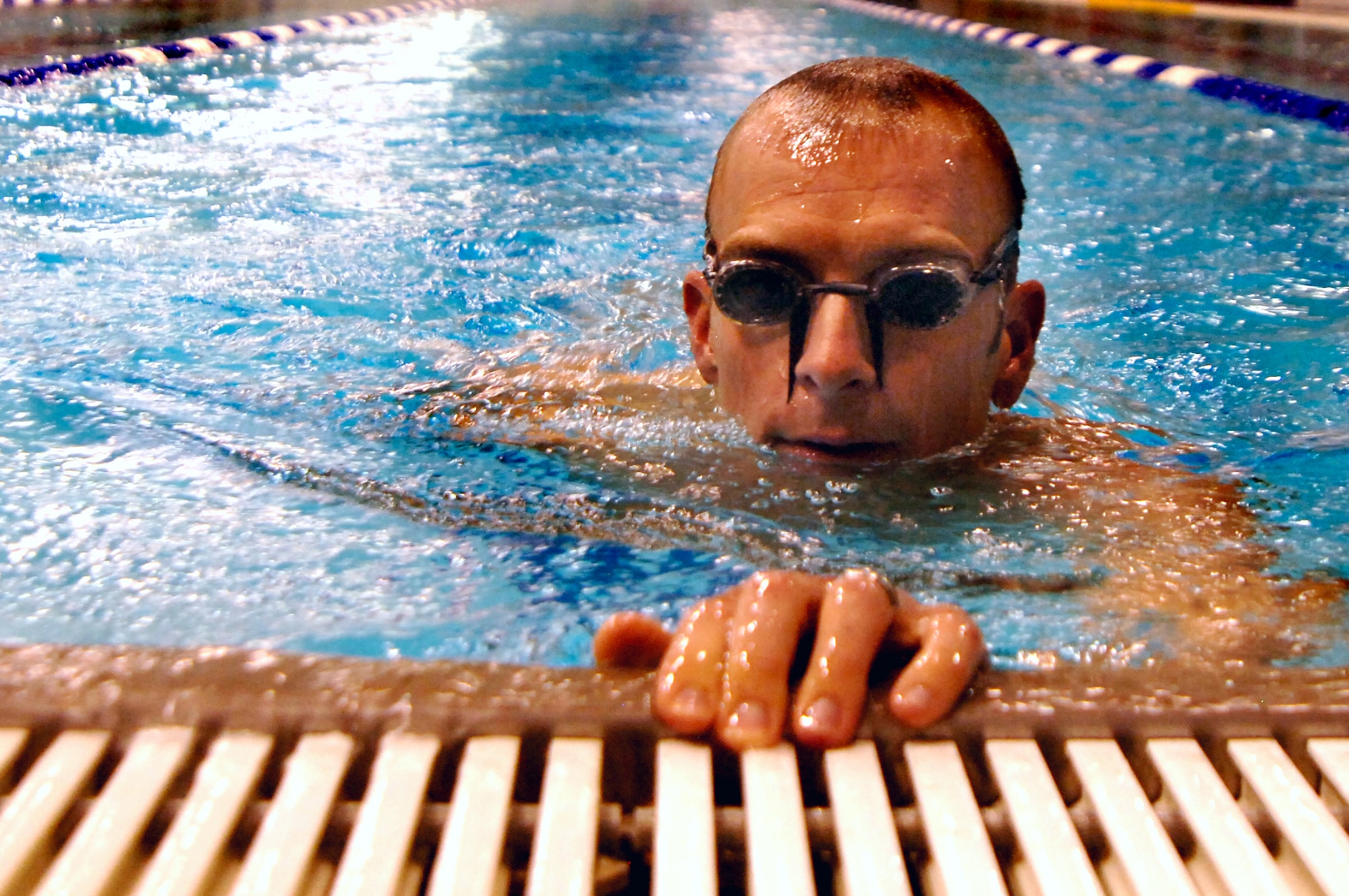 Maj. Scott "Kidd" Poteet, an Air Officer in Command for Cadet Squadron 02, trains for the 2010 Ironman Triathlon at the Cadet Gym pool Oct. 4, 2010 at the cadet gym pool.  Poteet's regimen includes more than three hours of training per day biking, swimming and running.  He typically swims 10,000-15,000 yards per week.  The Ironman Triathlon takes place Oct. 9 in Kona, Hawaii.  (U.S. Air Force photo/Staff Sgt. Raymond Hoy)