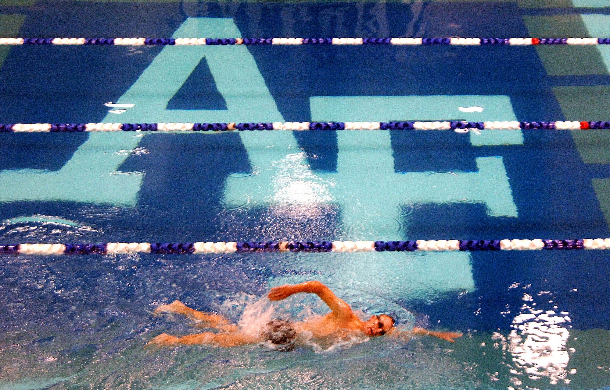 Maj. Scott "Kidd" Poteet, an Air Officer in Command for Cadet Squadron 02, trains for the 2010 Ironman Triathlon at the Cadet Gym pool Oct. 4, 2010 at the cadet gym pool.  Poteet's regimen includes more than three hours of training per day biking, swimming and running.  He typically swims 10,000-15,000 yards per week.  The Ironman Triathlon takes place Oct. 9 in Kona, Hawaii.  (U.S. Air Force photo/Staff Sgt. Raymond Hoy)