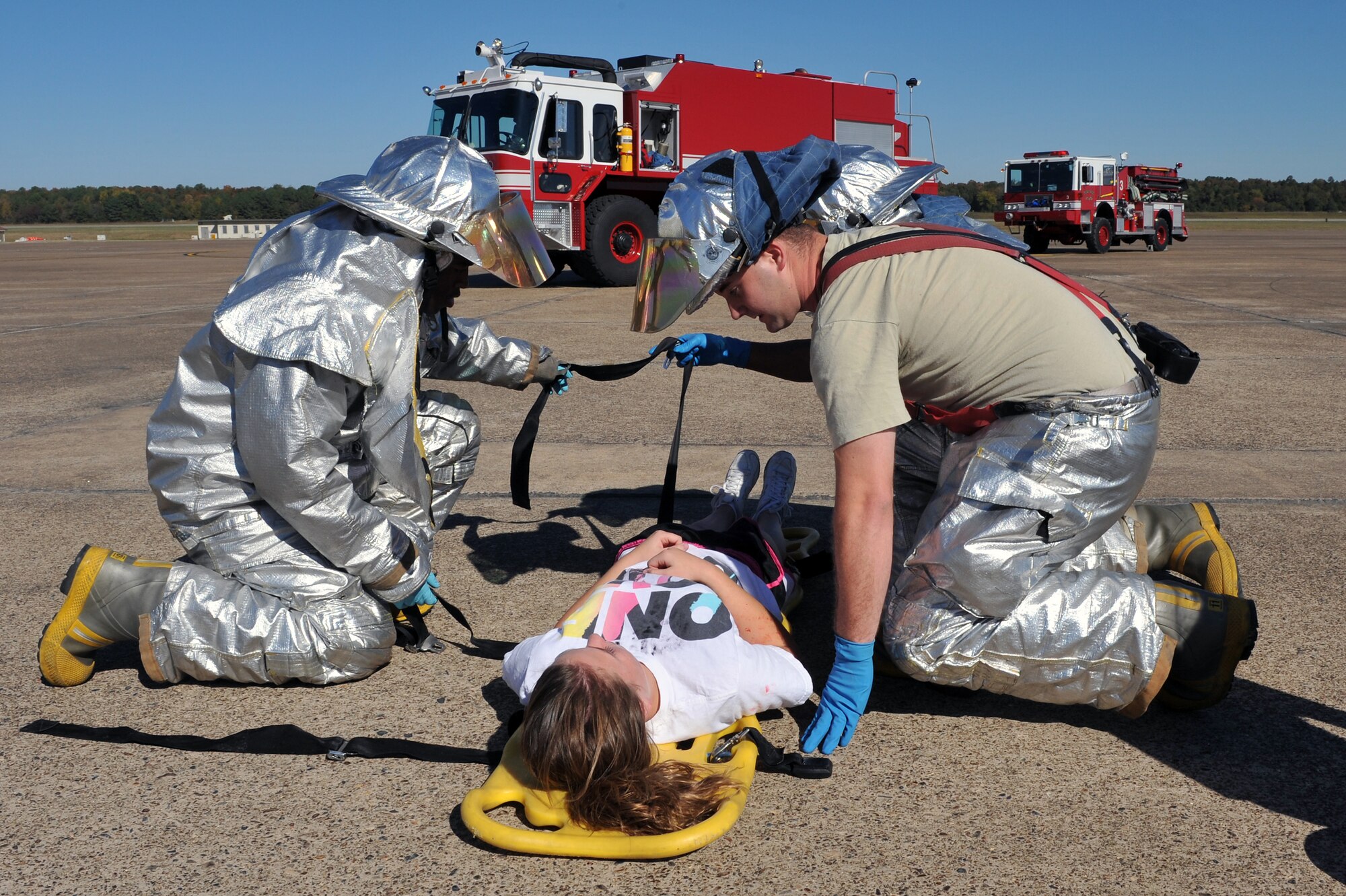 Members of the 19th Civil Engineer Squadron fire department respond to a Major Accident Response Exercise on the base flightline Oct. 1.  Little Rock Air Force Base Airmen responded to a simulated mass causality exercise in preparation for any emergency situation that could occur during the bases air show Oct. 9-10. (U.S. Air Force photo by Staff Sgt. Chris Willis)