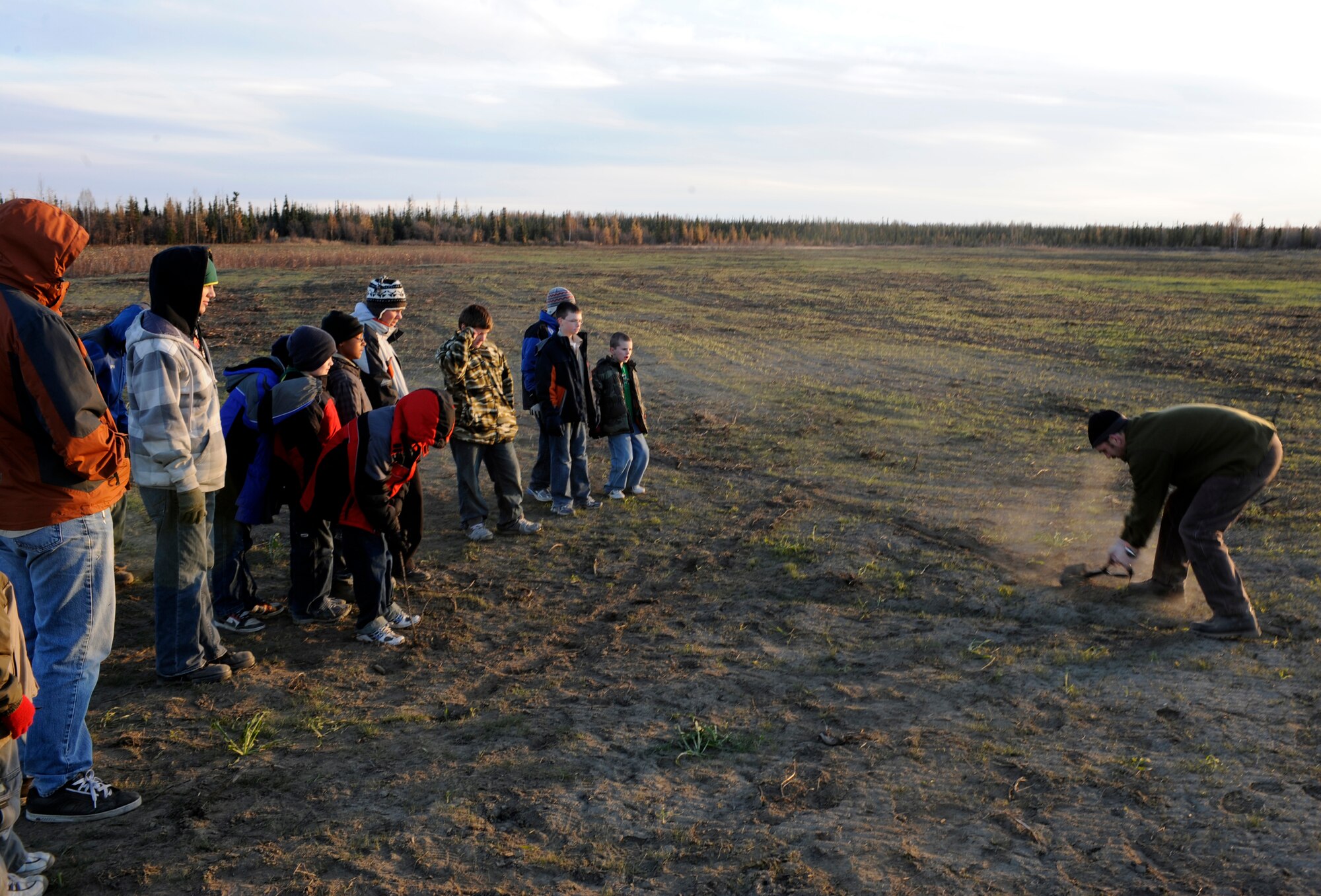 A local boy scout troop watches an instructor Sept. 28, 2010, Eielson Air Force Base, Alaska. The class was instructed by a U.S. Air Force Survival Evasion Resistance Escape Specialist. The training was based on signaling and will help the Scouts fulfill requirements toward merit badges. (U.S. Air Force photo/Senior Airman Willard E. Grande II)