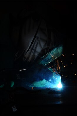 ELLSWORTH AIR FORCE BASE, S.D. – Airman 1st Class Shelly Jenkins, 28th Maintenance Squadron aircraft metals technology apprentice, practices metal inert-gas welding on a piece of steel, Sept. 30. Airman Jenkins trains on routine basis to maintain her skills. (U.S. Air Force photo/Senior Airman Kasey Close)