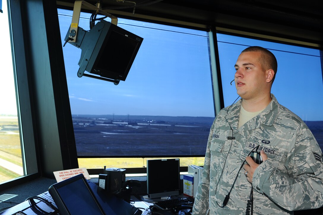 ELLSWORTH AFB, S.D. – Senior Airman Mark Ensign, 28th Operations Support Squadron air traffic controller journeyman, visually scans the runway, Sept. 30. Airman Ensign ensures the runway is clear of any obstacles before an aircraft takes off or lands. (U.S. Air Force photo/Senior Airman Kasey Close)