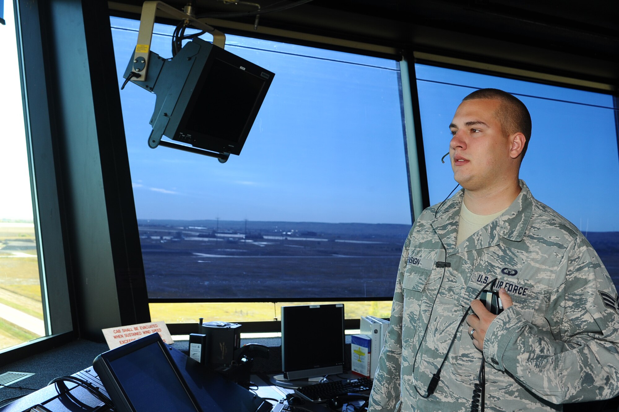 ELLSWORTH AFB, S.D. – Senior Airman Mark Ensign, 28th Operations Support Squadron air traffic controller journeyman, visually scans the runway, Sept. 30. Airman Ensign ensures the runway is clear of any obstacles before an aircraft takes off or lands. (U.S. Air Force photo/Senior Airman Kasey Close)