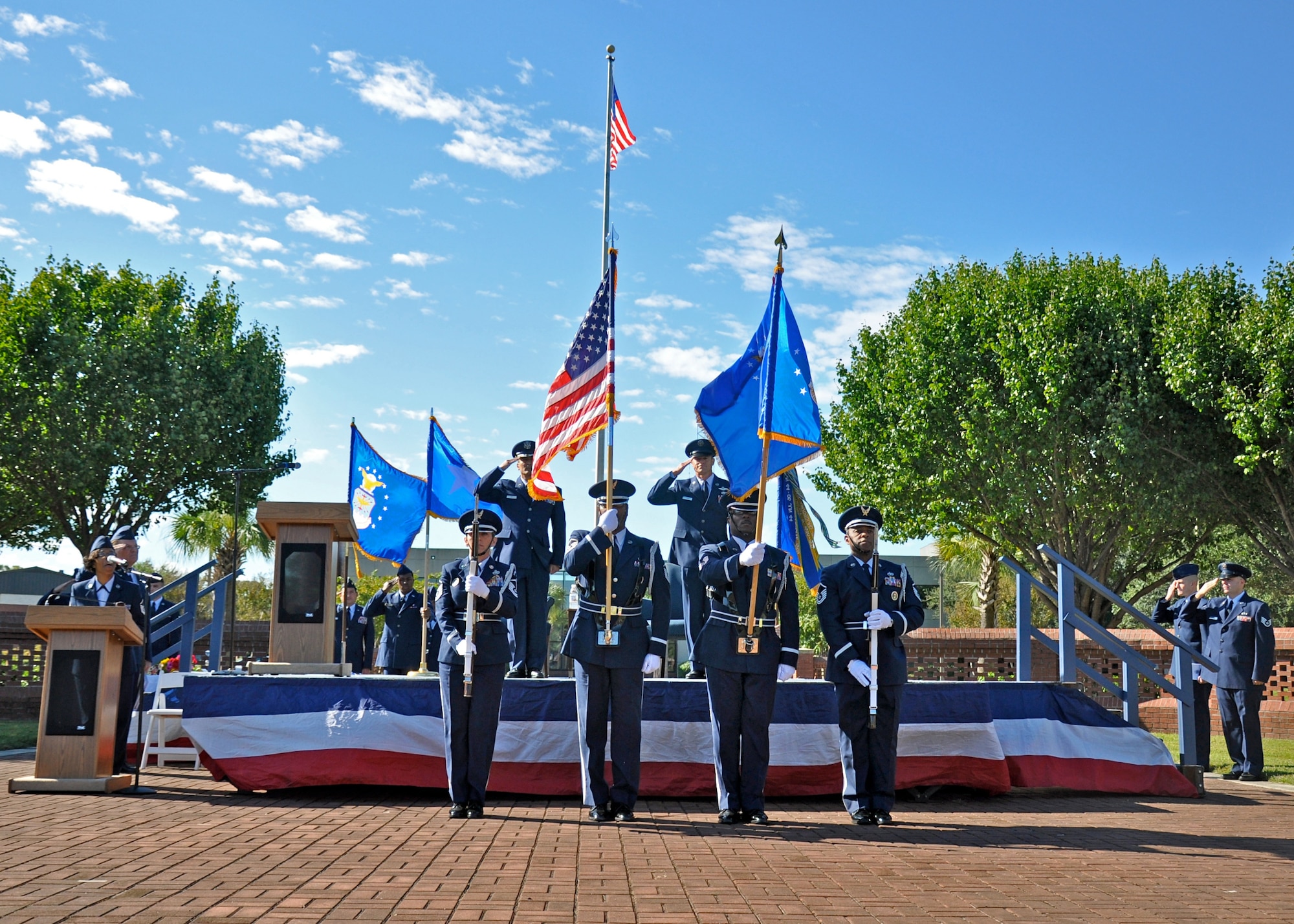 Master Sgt. Nichelle Cunningham sings the national anthem during the retirement ceremony for Chief Master Sgt. Benson S. (Ben) Futrell Oct. 3, 2010 at the Joint Base Charleston Flagpole. Sergeant Cunningham is a paralegal with the 315th Airlift Wing and Chief Futrell is retiring as the 315 AW command chief master sergeant. (U.S. Air Force photo/Staff Sgt. Shane Ellis)