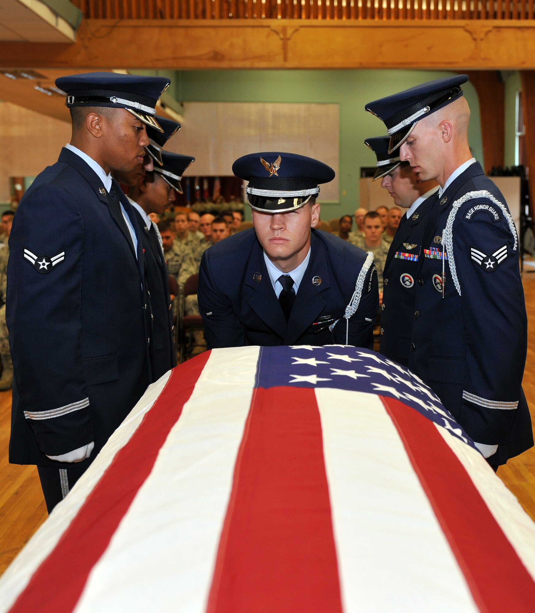 Members from the Little Rock Air Force Base Honor Guard perform a flag folding presentation during their graduation ceremony Sept. 29.  Twenty-six Airmen from the 19th Airlift Wing; 314th Airlift Wing; 189th Airlift Wing; and 188th Fighter Wing, Fort Smith, Ark.; graduated from the training conducted by a Mobile Training Team from Bolling Air Force Base, D.C.  (U.S. Air Force photo by Staff Sgt. Chris Willis)
