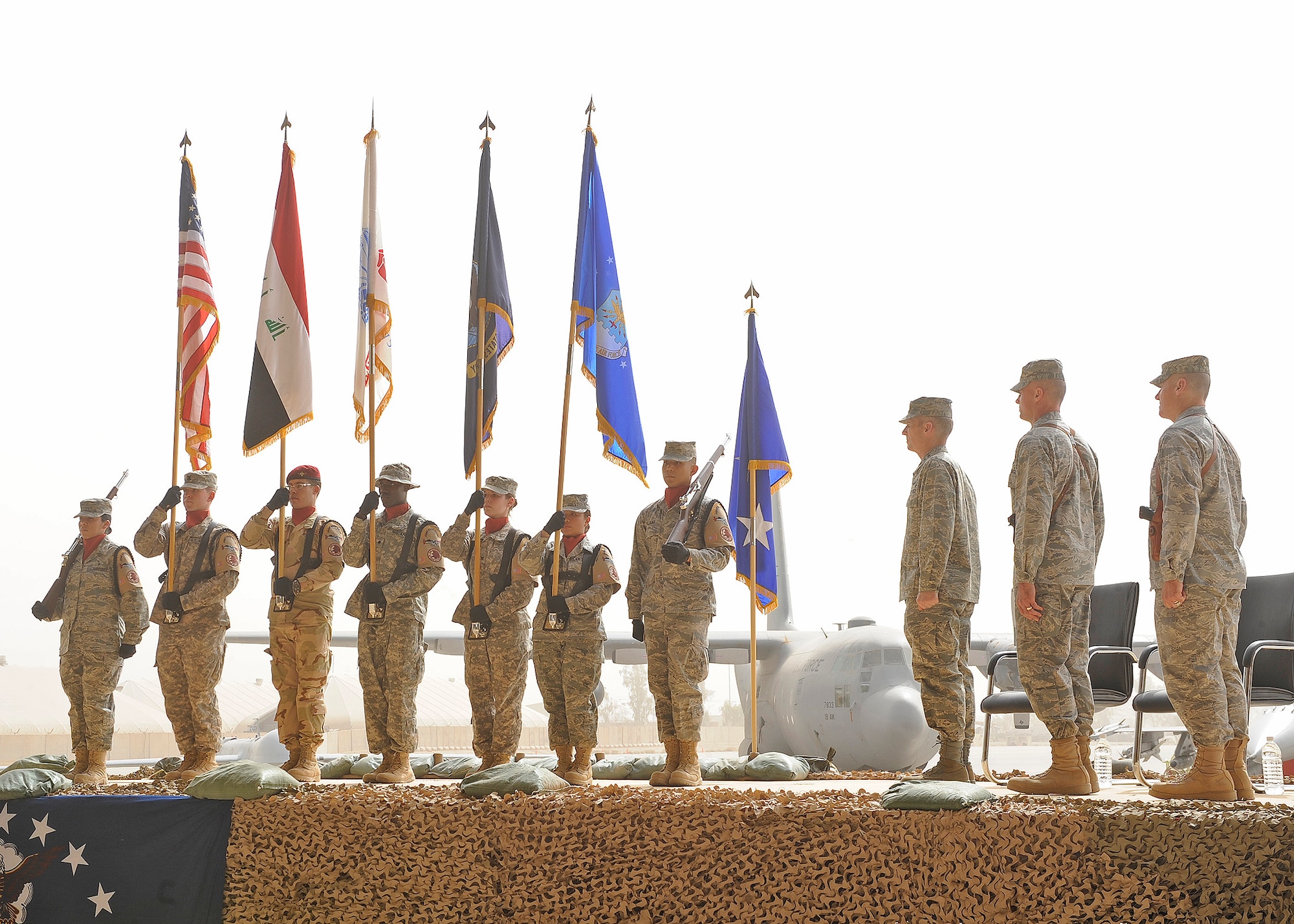 Joint Base Balad Honor Guard members present the colors as the official party comes to attention for the 332nd Air Expeditionary Wing's Change of Command Ceremony Oct. 5, 2010, Joint Base Balad, Iraq. Brig. Gen. Kurt Neubauer assumed command of the wing during the ceremony. (U.S. Air Force photo/ Senior Airman Matt Coleman-Foster)