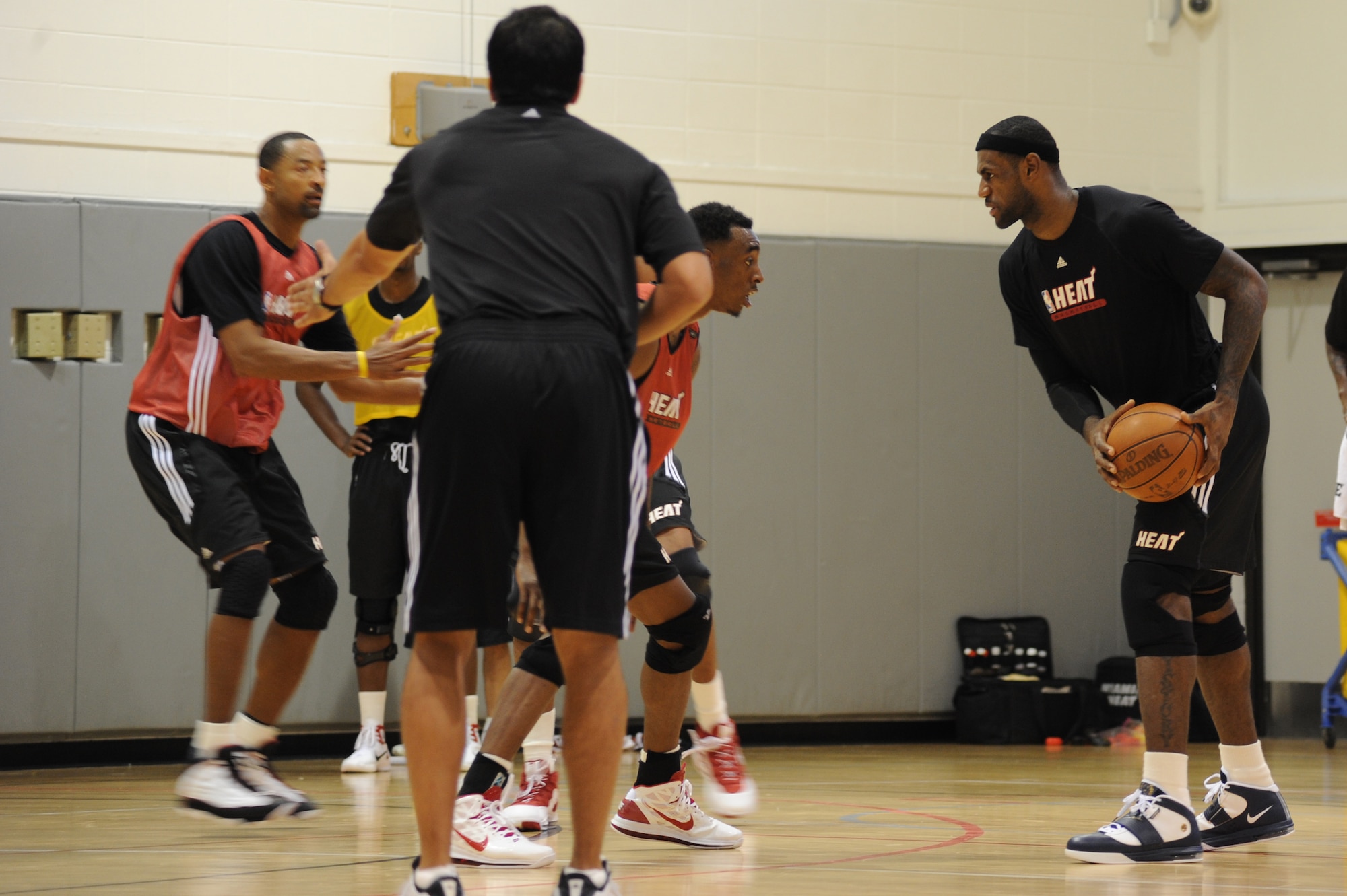 LeBron James, Miami HEAT forward, prepares to drive a basketball while  during a 2010 Training Camp practice session at the Aderholt Fitness Center at Hurlburt Field, Fla., Sept. 29, 2010. The team requested the use of the fitness center for their week-long training camp, and 1st Special Operations Wing leadership agreed to support the visit. (DoD photo by U.S. Air Force Senior Airman Sheila deVera) (RELEASED)
