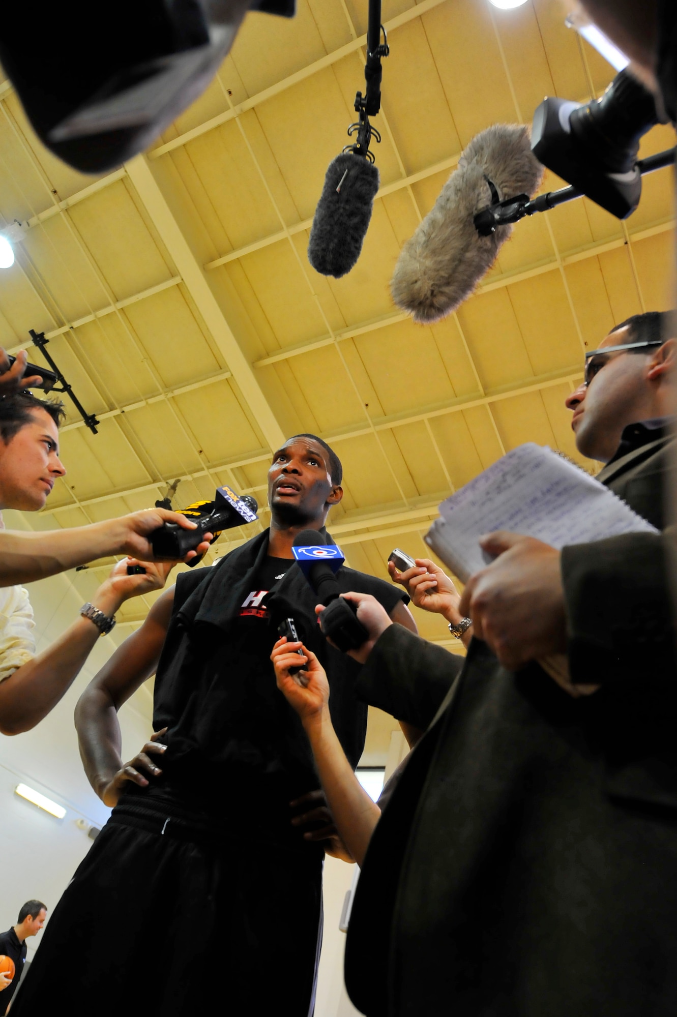 Chris Bosh, Miami HEAT forward, answers questions during a press
conference after a practice session at the Aderholt Fitness Center at Hurlburt Field, Fla., Sept. 29, 2010. The team requested the use of the fitness center for their week-long training camp, and 1st Special Operations Wing leadership agreed to support the visit. (DoD photo by U.S. Air Force Senior Airman Sheila deVera/RELEASED)
