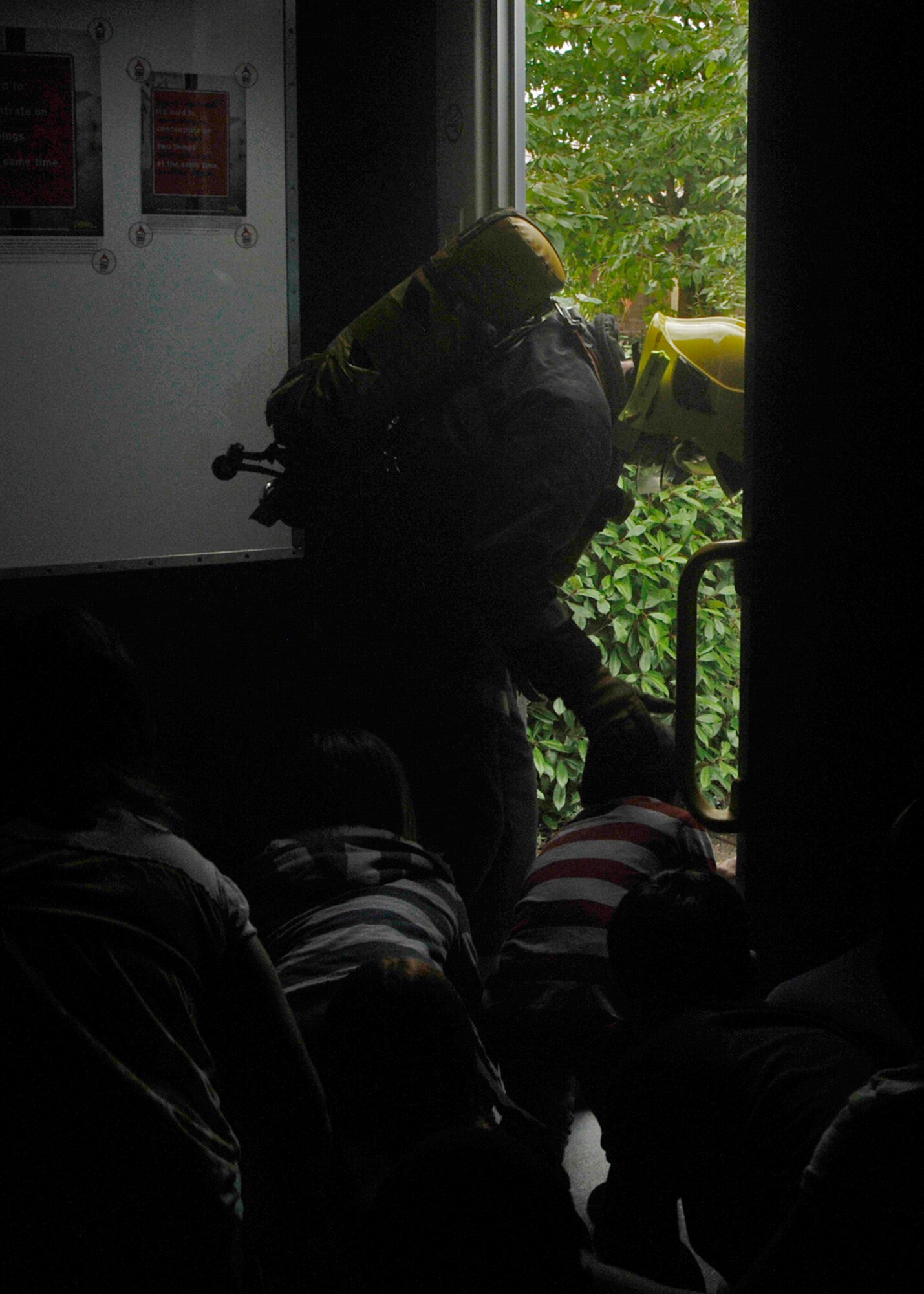 ROYAL AIR FORCE LAKENHEATH England - Suffolk Fire and Rescue Service firefighter Danny O’Neill leads RAF Lakenheath Intermediate School students to safety from a simulated bedroom fire during National Fire Prevention Week on Oct. 5. The students pointed out fire hazards in the room, were told how to prevent fires, got down on the ground when the smoke filled the room and followed the firefighter to safety. (U.S. Air Force photo/Airman 1st Class Tiffany M. Deuel)