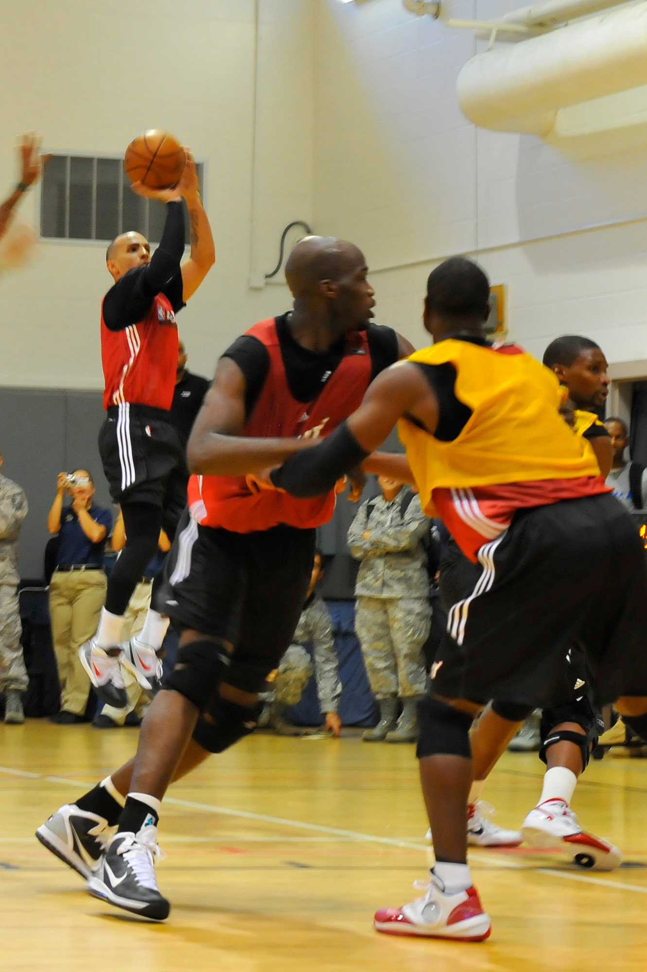 Carlos Arroyo, Miami HEAT guard, prepares to shoot a basketball during a 2010 Training Camp practice session at the Aderholt Fitness Center at Hurlburt Field, Fla., Sept. 29, 2010. The team requested the use of the fitness center for their week-long training camp, and 1st Special Operations Wing leadership agreed to support the visit. (DoD photo by U.S. Air Force Senior Airman Sheila deVera/RELEASED)
