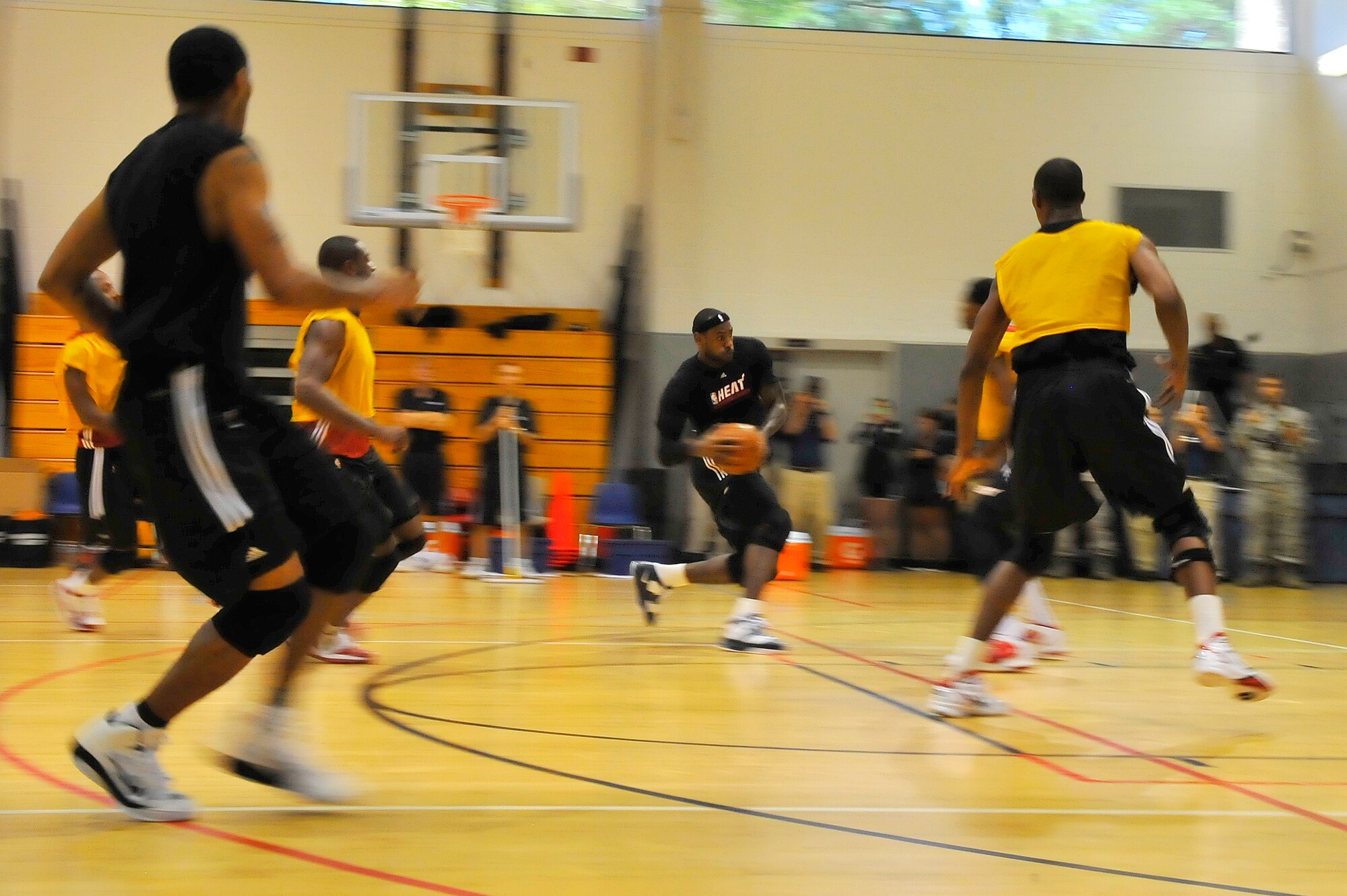 LeBron James, Miami HEAT forward, drives to the basket during a 2010 Training Camp practice session at the Aderholt Fitness Center at Hurlburt Field, Fla., Sept. 29, 2010. The team requested the use of the fitness center for their week-long training camp, and 1st Special Operations Wing leadership agreed to support the visit. (DoD photo by U.S. Air Force Senior Airman Sheila deVera/RELEASED)
