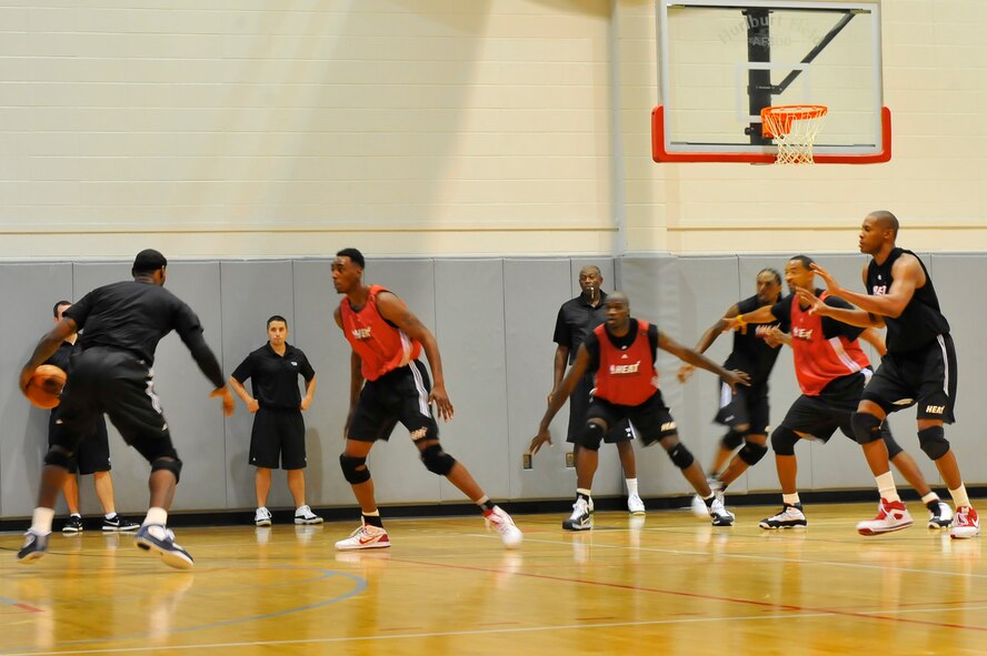 LeBron James, Miami HEAT forward, drives the basketball during a 2010 Training Camp practice session at the Aderholt Fitness Center at Hurlburt Field, Fla., Sept. 29, 2010. The team requested the use of the fitness center for their week-long training camp, and 1st Special Operations Wing leadership agreed to support the visit. (DoD photo by U.S. Air Force Senior Airman Sheila deVera/RELEASED)
