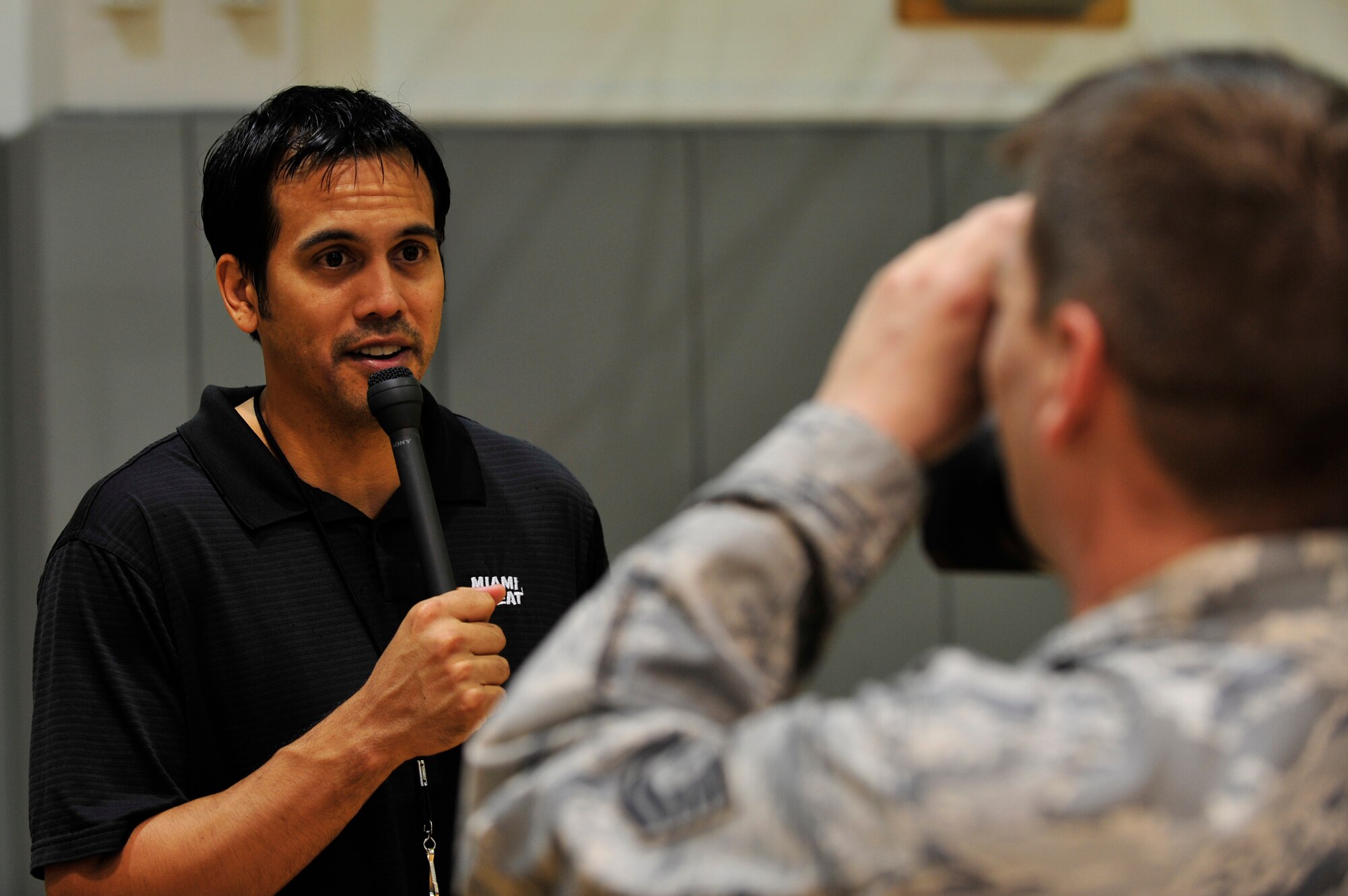 Erik Spoelstra, Miami HEAT head coach, is interviewed by Tech. Sgt Pete Blanding, 1st Special Operations Wing Public Affairs broadcaster during the Miami HEAT 2010 Training Camp at the Aderholt Fitness Center, Hurlburt Field, Fla., Sept. 29, 2010. The team requested the use of the fitness center for their week-long training camp, and 1st Special Operations Wing leadership agreed to support the visit. (DoD photo by U.S. Air Force Staff Sgt. Stephanie Jacobs/RELEASED)
