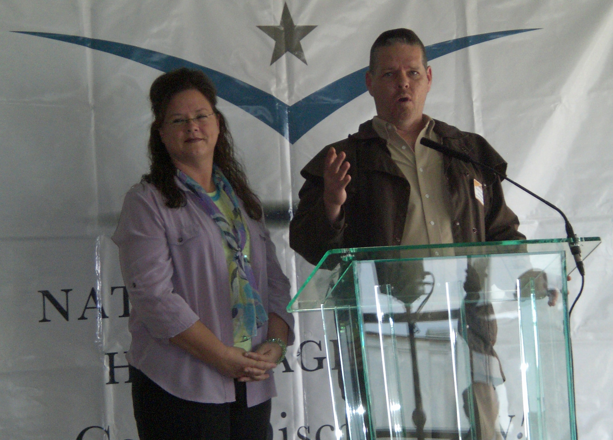 Lecia Lamphere and Philip McKeachie speak during a reception Oct. 2, 2010 at Rickenbacker International Airport following a reenactment of the world’s first cargo flight.  The original flight took place Nov. 7, 1910, and was made by Wright Company pilot Phil Parmelee in a Wright “B” Flyer from Huffman Prairie Flying Field (now part of Wright-Patterson Air Force Base) to Columbus, Ohio. Ms. Lamphere and Mr. McKeachie are descendents of Phil Parmelee and were joined by Wright Brothers family members to celebrate the birth of the modern air cargo industry.  (U.S. Air Force photo/Derek Kaufman)