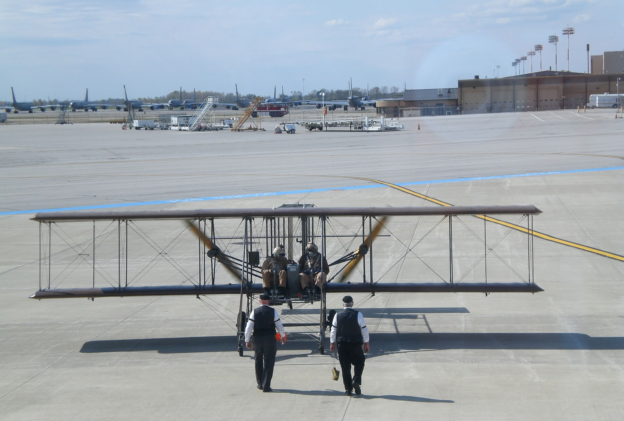 A lookalike Wright “B” Flyer taxis at Rickenbacker International Airport after completing a Oct. 2, 2010 reenactment of the world’s first cargo flight.  The original flight took place Nov. 7, 1910, and was made by Wright Company pilot Phil Parmelee from Huffman Prairie Flying Field (now part of Wright-Patterson Air Force Base) to Columbus, Ohio. In the background are KC-135R tankers from the Ohio National Guard’s 121st Air Refueling Wing. (U.S. Air Force photo/Derek Kaufman)
