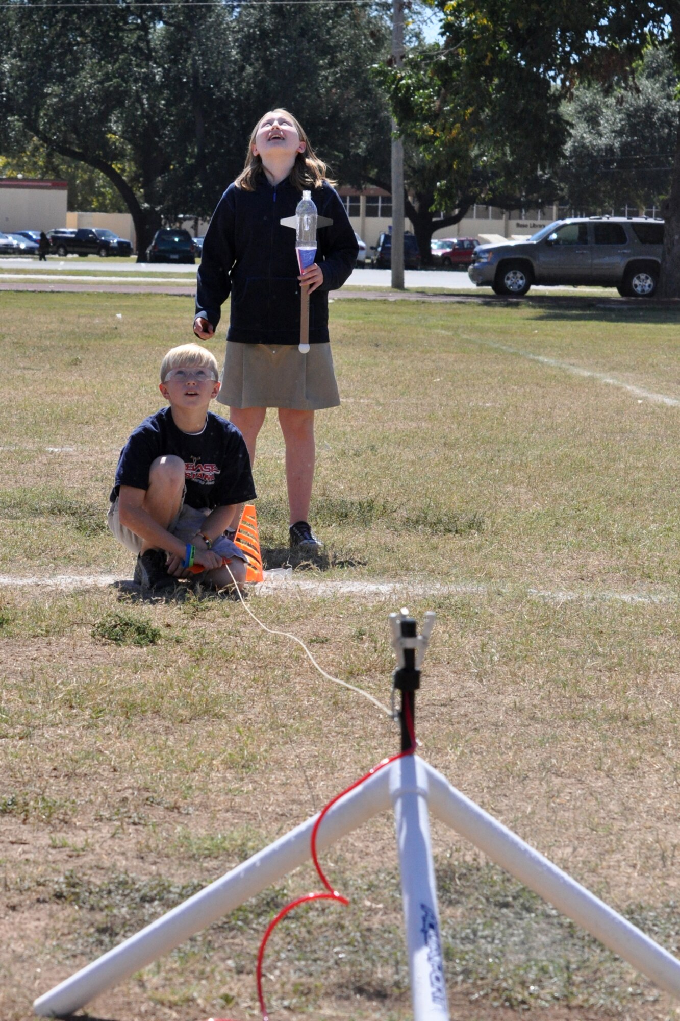 Ryley Snellgrove and Zoey Thomas gaze upward as Ryley’s rocket travels into the sky over the football field at the fitness center on Barksdale Air Force Base, La., Oct. 1, 2010. Ryley and Zoey are 5th Graders at Princeton Elementary School in Haughton, La. They are students attending STARBASE Louisiana, one of 60 national STARBASE sites. It is sponsored by the 917th Wing of the Air Force Reserve Command. The program presents an exciting 25-hour hands on/minds on aviation and aerospace curriculum to area 5th grade students and their teachers. The DoD program is committed to addressing the critical needs in STEM education - Science, Technology, Engineering and Mathematics - STARBASE Louisiana introduces its students to exciting STEM education topics, inspiring these young minds to further explore these topics in future course work. (U.S. Air Force photo/Tech. Sgt. Jeff Walston)