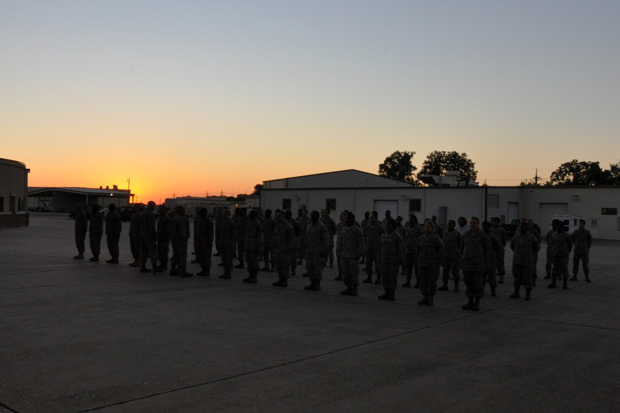Before the sun even rises, members of the 917th Logistics Readiness Squadron at Barksdale Air Force Base, La., stand inspection in front of the maintenance hangar at the beginning the Unit Training Assembly weekend Oct. 1, 2010. The 917th Wing is a composite wing which operates both the A-10A Thunderbolt II and the B-52H Stratofortress. Located at Barksdale AFB, La., the Wing employs approximately 1,700 Air Force Reserve personnel. (U.S. Air Force photo/Tech. Sgt. Jeff Walston)

