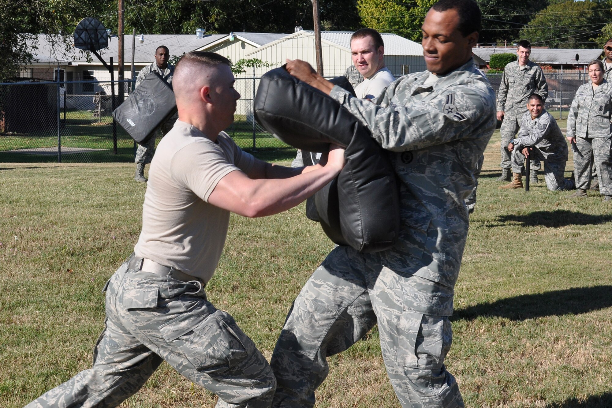 Technical Sgt. Jason Fruge, a security policeman with the 917th Security Forces Squadron, performs a center strike to the pad of Airman First Class Colby Newborn, a security forces journeyman with the 917th SFS, during an ASP Certification Training class outside the 917th SFS building at Barksdale Air Force Base, La., Oct. 3, 2010. The class was in the middle of its two-minute reaction drills, where the participant must engage eight different pads continuously for two minutes, with constantly changing strike commands from the instructor. The evolution is designed to wear a participant down, thus building endurance. (U.S. Air Force photo/Tech. Sgt. Jeff Walston)
 
