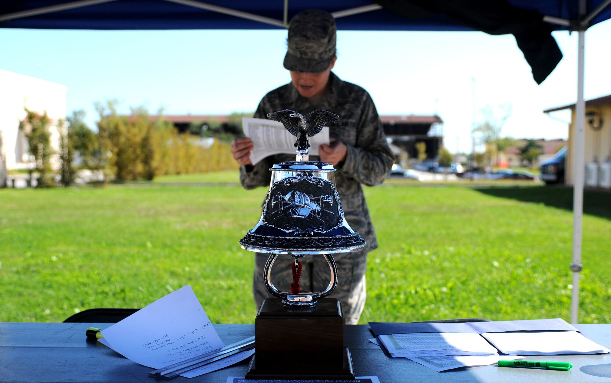 Staff Sgt. Stephanie Nalepka, 31st Communications Squadron Post Office official mail technician, reads U.S. servicemembers's names who are missing in action during a POW/MIA 24-hour vigil at the base theater Sept. 29. (U.S. Air Force photo/Staff Sgt. Julius Delos Reyes)