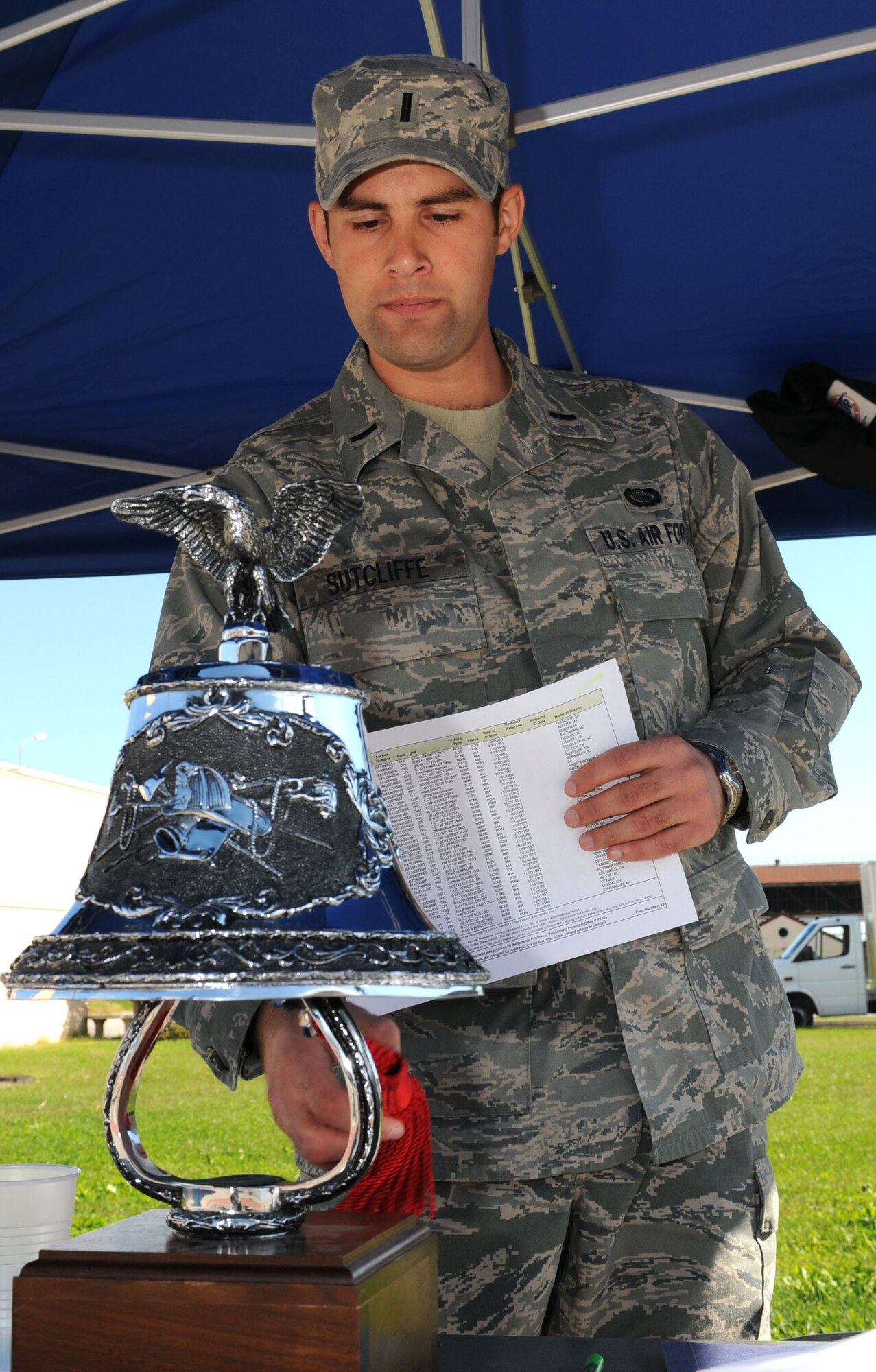 First Lt. John Sutcliffe, 31st Operations Group chief of systems and security, ring the bell during a POW/MIA citation vigil Sept. 29. (U.S. Air Force photo/Staff Sgt. Julius Delos Reyes)