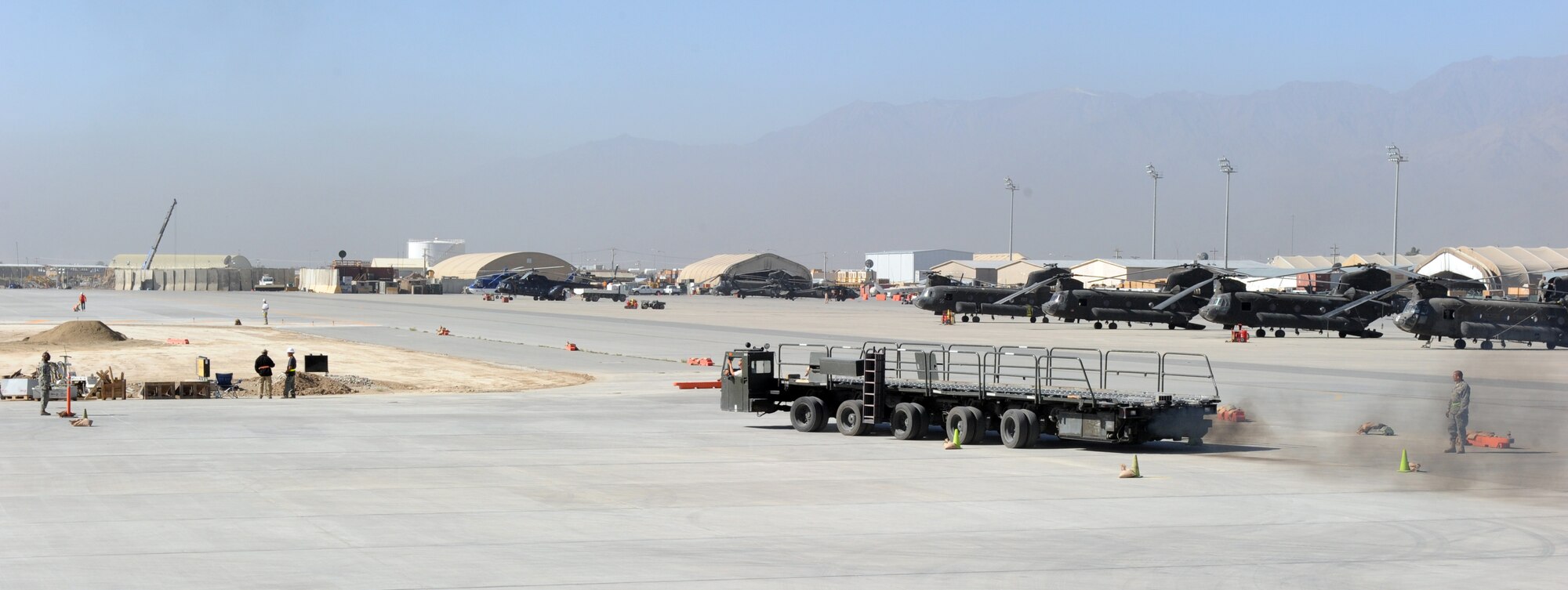 Airmen assigned to the 455th Expedtionary Aerial Port Squadron at Bagram Airfield, Afghanistan, drive a Tunner 60K loader through an obstacle course on the flightline here Oct. 3, 2010. The course was part of a class meant to reinforce safe operational practices. The loader is named after the late Lt. Gen. William H. Tunner, a former commander of U.S. Air Forces in Europe.(U.S. Air Force Photo/Tech. Sgt. Drew Nystrom
