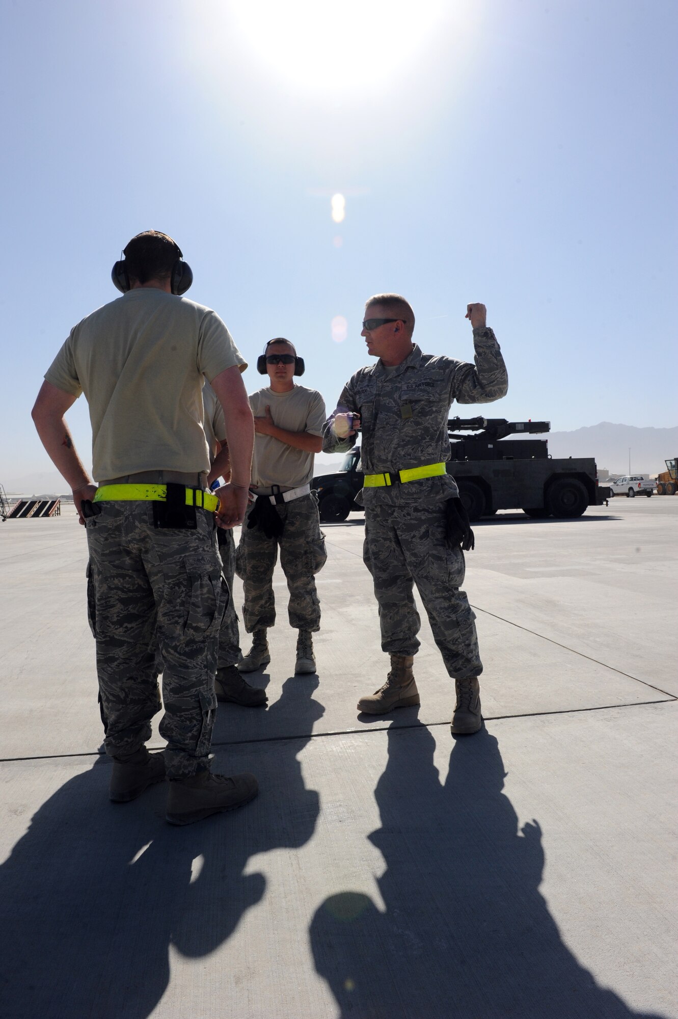 Tech. Sgt. Bob Medlock, assigned to the 455th Expedtionary Aerial Port Squadron at Bagram Airfield, Afghanistan, explains safe operating habits and the importance of situational awareness before letting Airmen drive a Tunner 60K loader through an obstacle course on the flightline here Oct. 3, 2010. The course was part of a class meant to reinforce safe operational practices. The loader is named after the late Lt. Gen. William H. Tunner, a former commander of U.S. Air Forces in Europe.(U.S. Air Force Photo/Tech. Sgt. Drew Nystrom